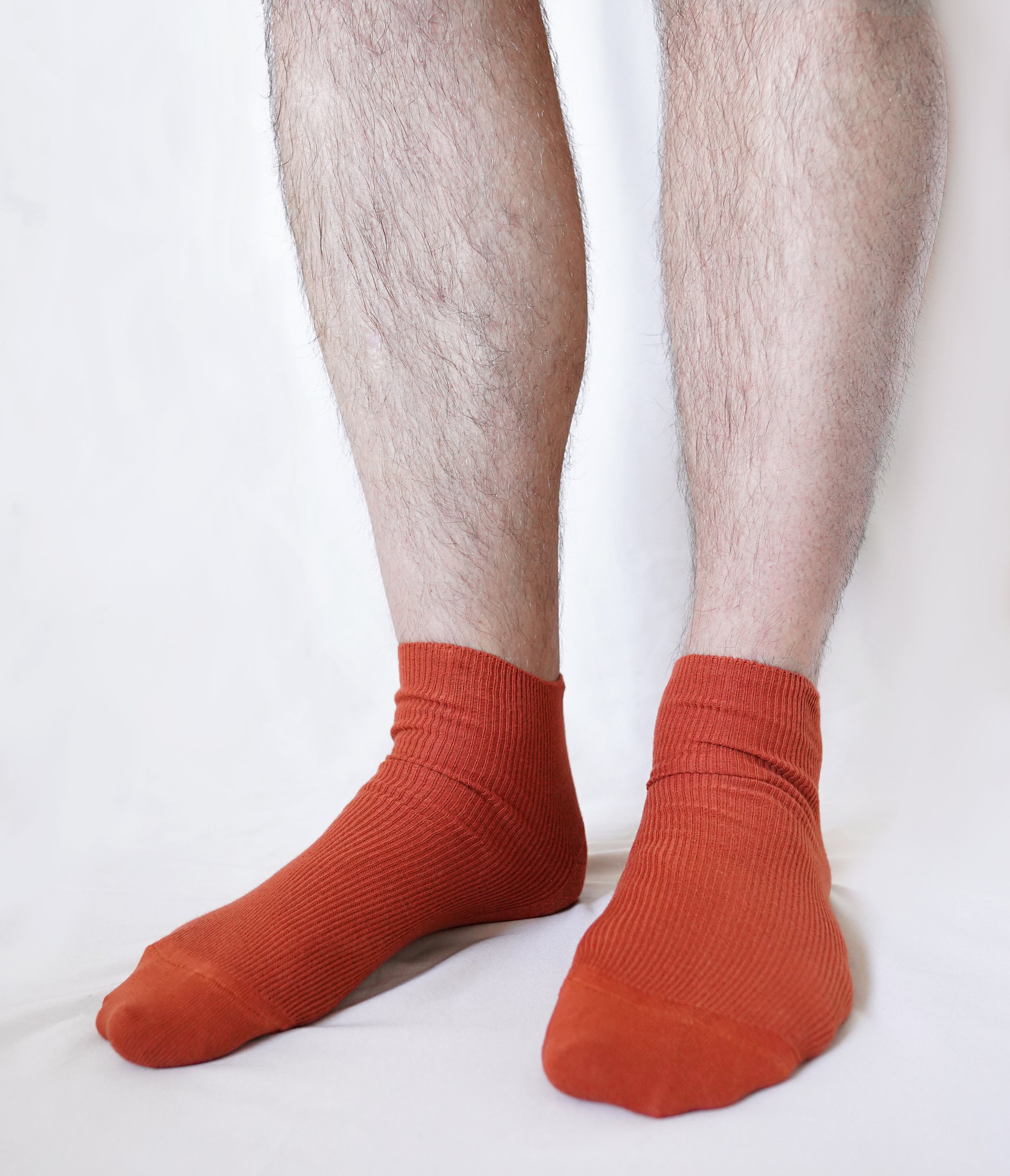 A pair of tittimitti® 100% Organic Combed Cotton Luxury Men's Socks in various colors, showcasing their soft texture and stylish design.