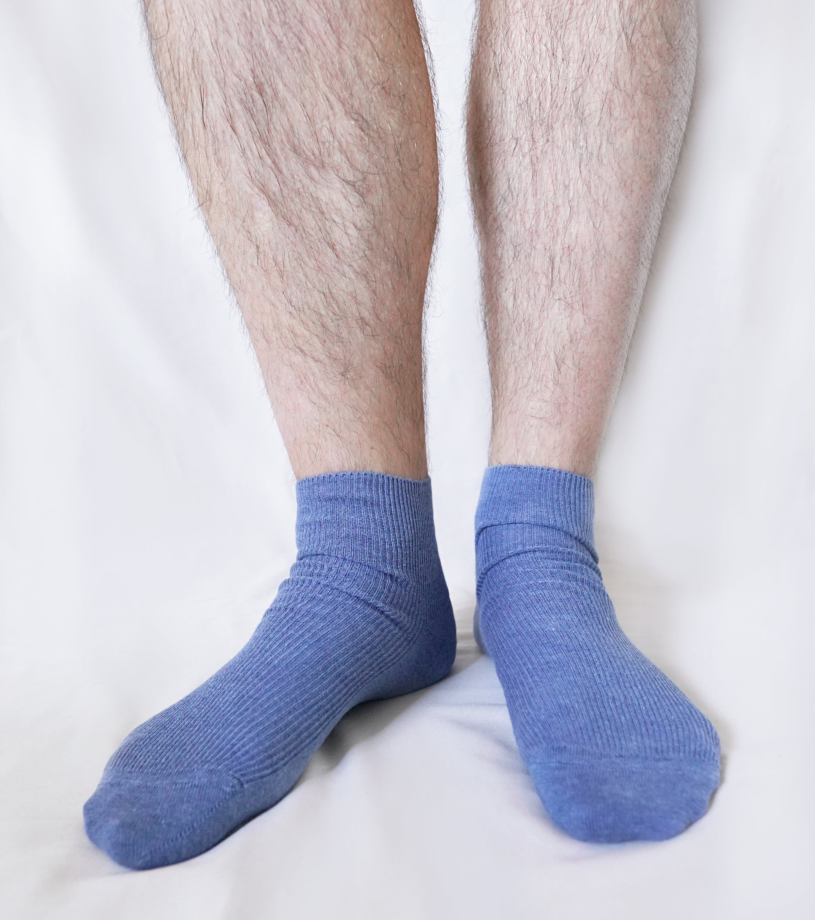 A pair of tittimitti® 100% Organic Combed Cotton Luxury Men's Socks in various colors, showcasing their soft texture and stylish design.