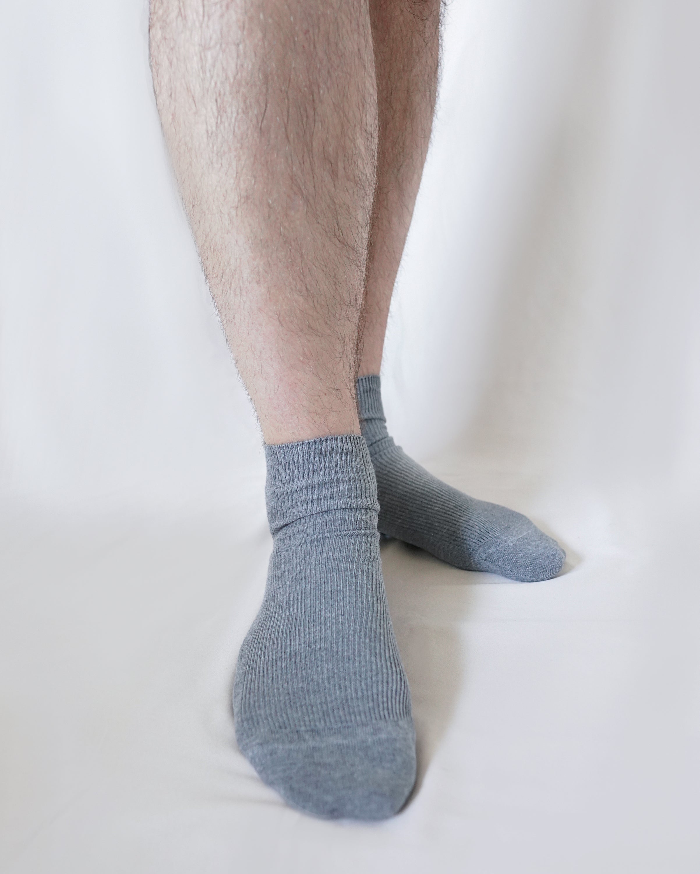 A pair of tittimitti® 100% Organic Combed Cotton Luxury Men's Socks in various colors, showcasing their soft texture and stylish design.