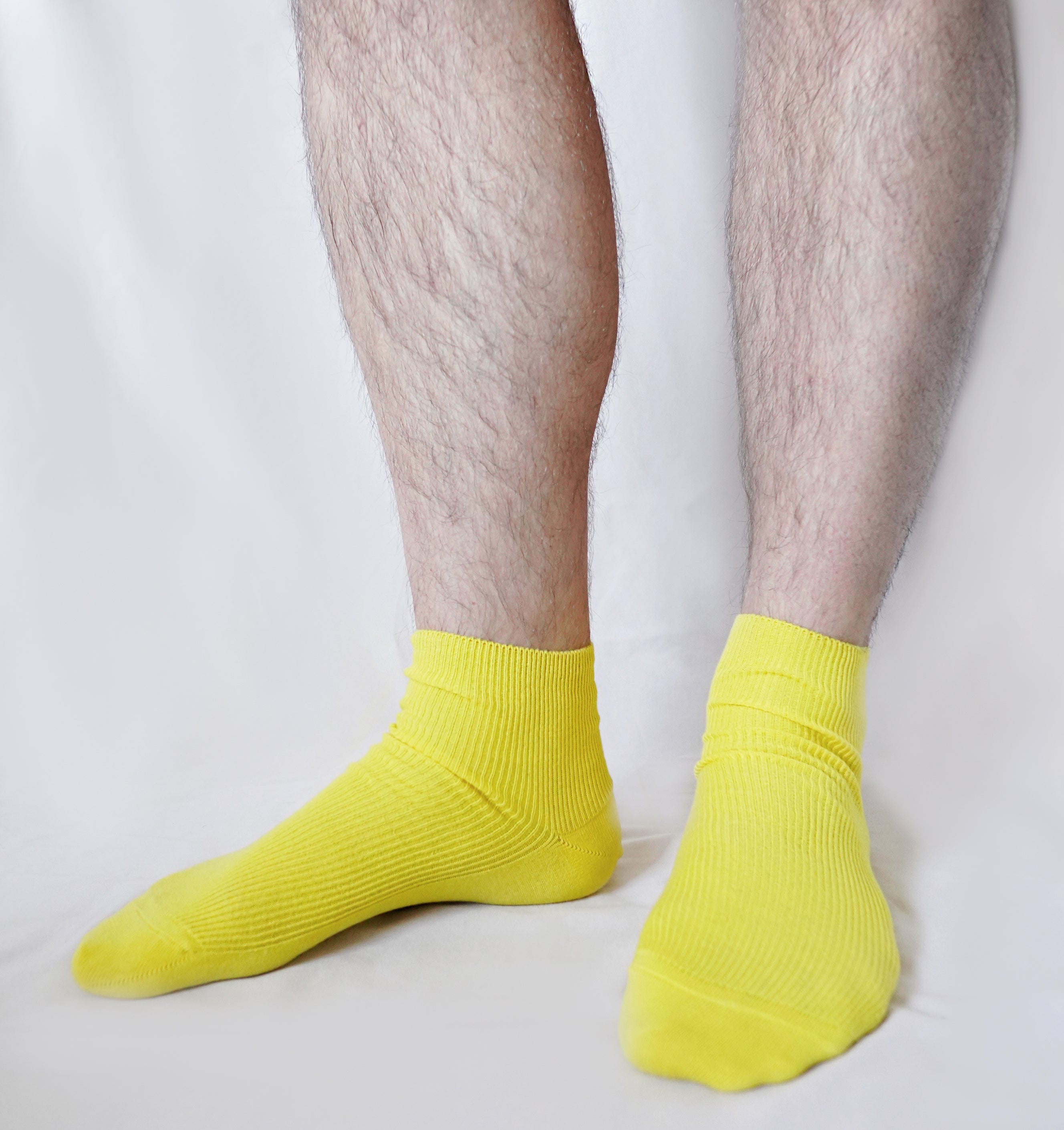 A pair of tittimitti® 100% Organic Combed Cotton Luxury Men's Socks in various colors, showcasing their soft texture and stylish design.