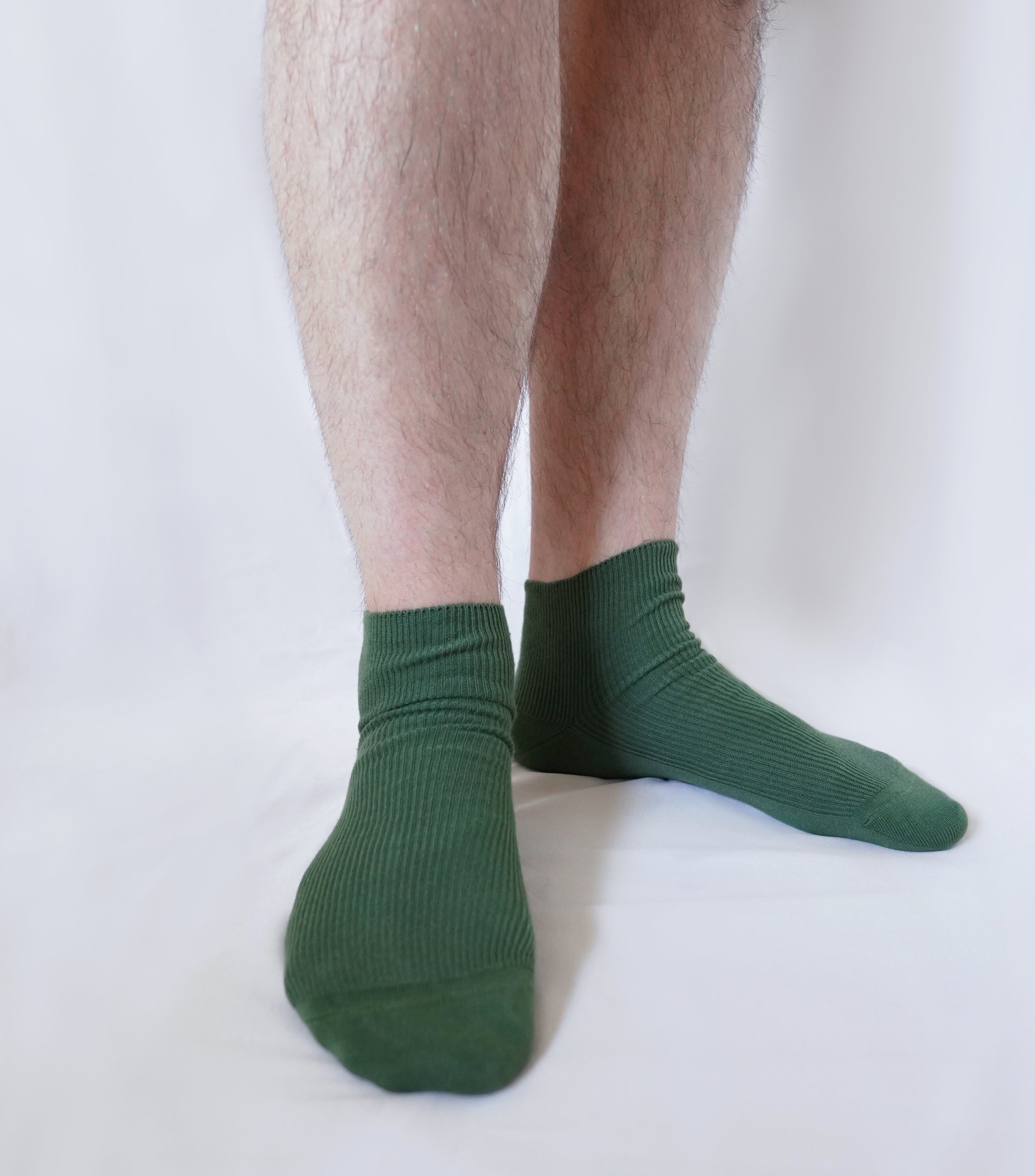 A pair of tittimitti® 100% Organic Combed Cotton Luxury Men's Socks in various colors, showcasing their soft texture and stylish design.