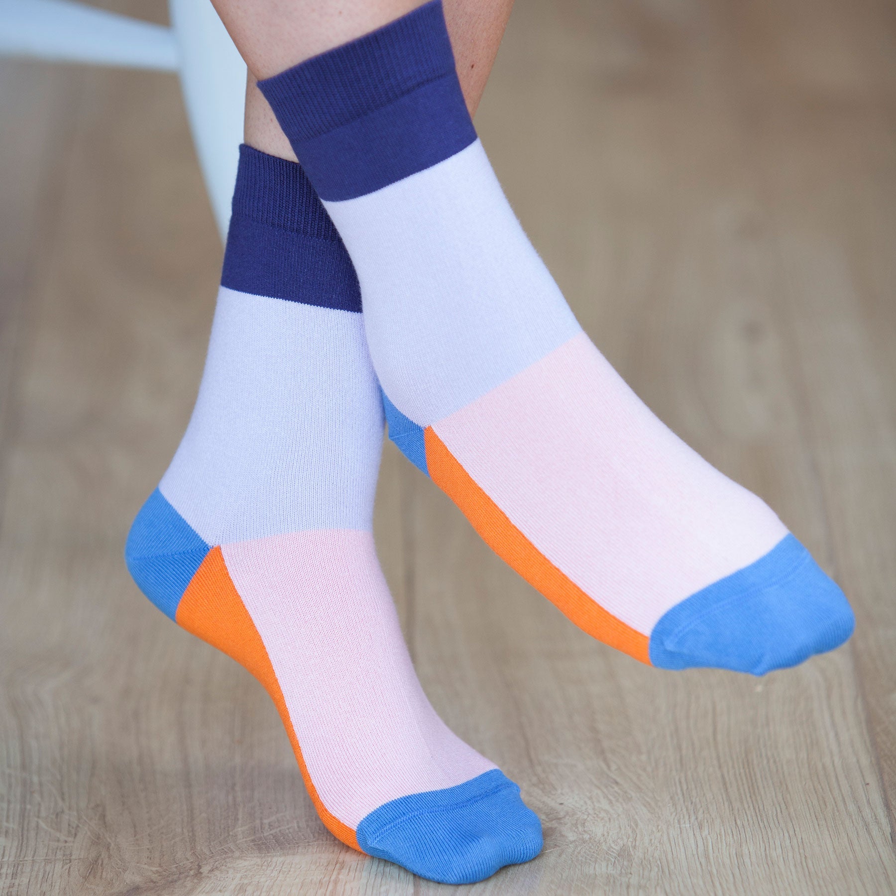 A pair of vibrant lavender Victoria Women's Socks featuring contrasting colors including navy, pink, blue, and orange, elegantly displayed.