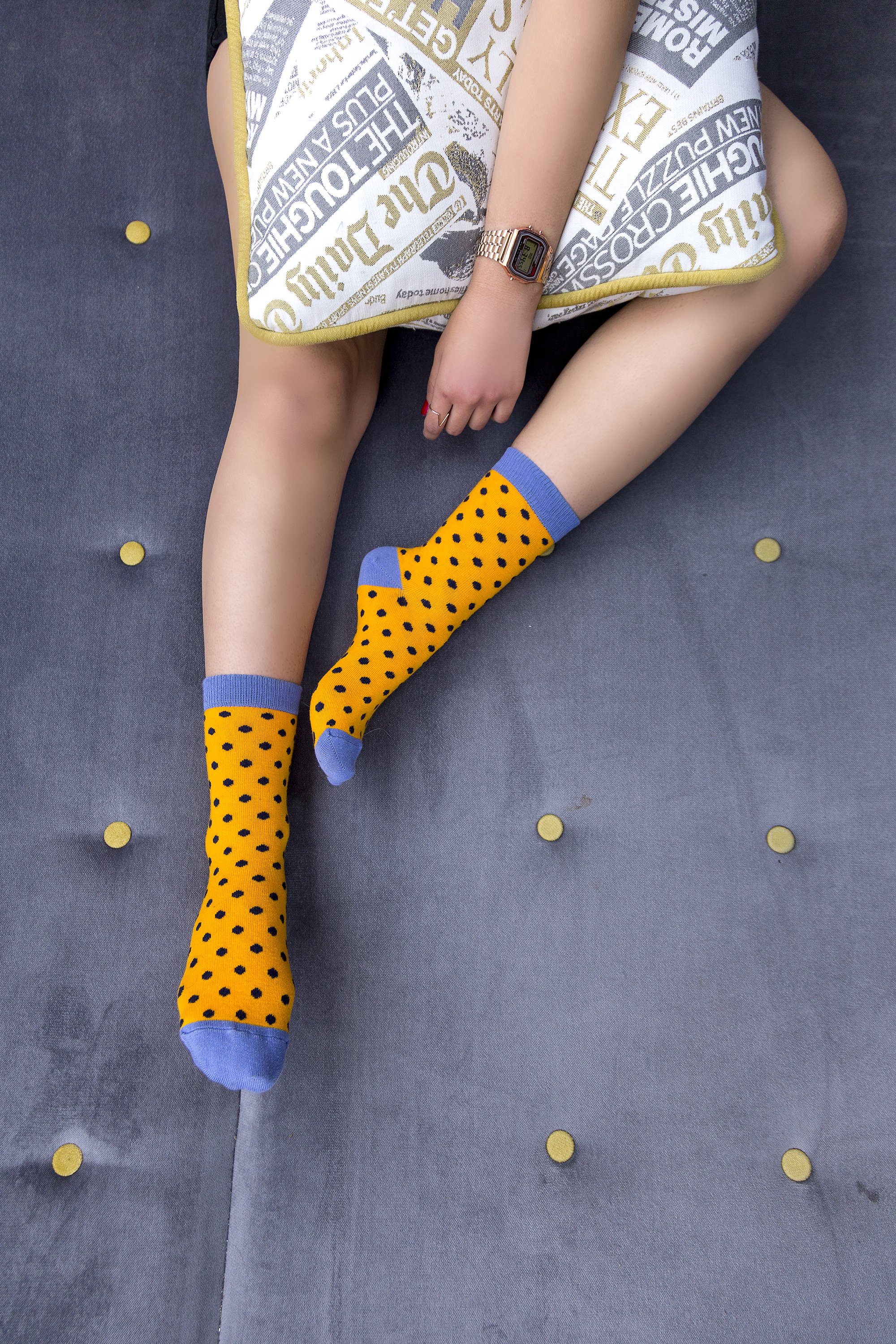 A pair of Women's Apricot Dot Socks featuring a colorful dot pattern, made from soft Turkish cotton for comfort and style.