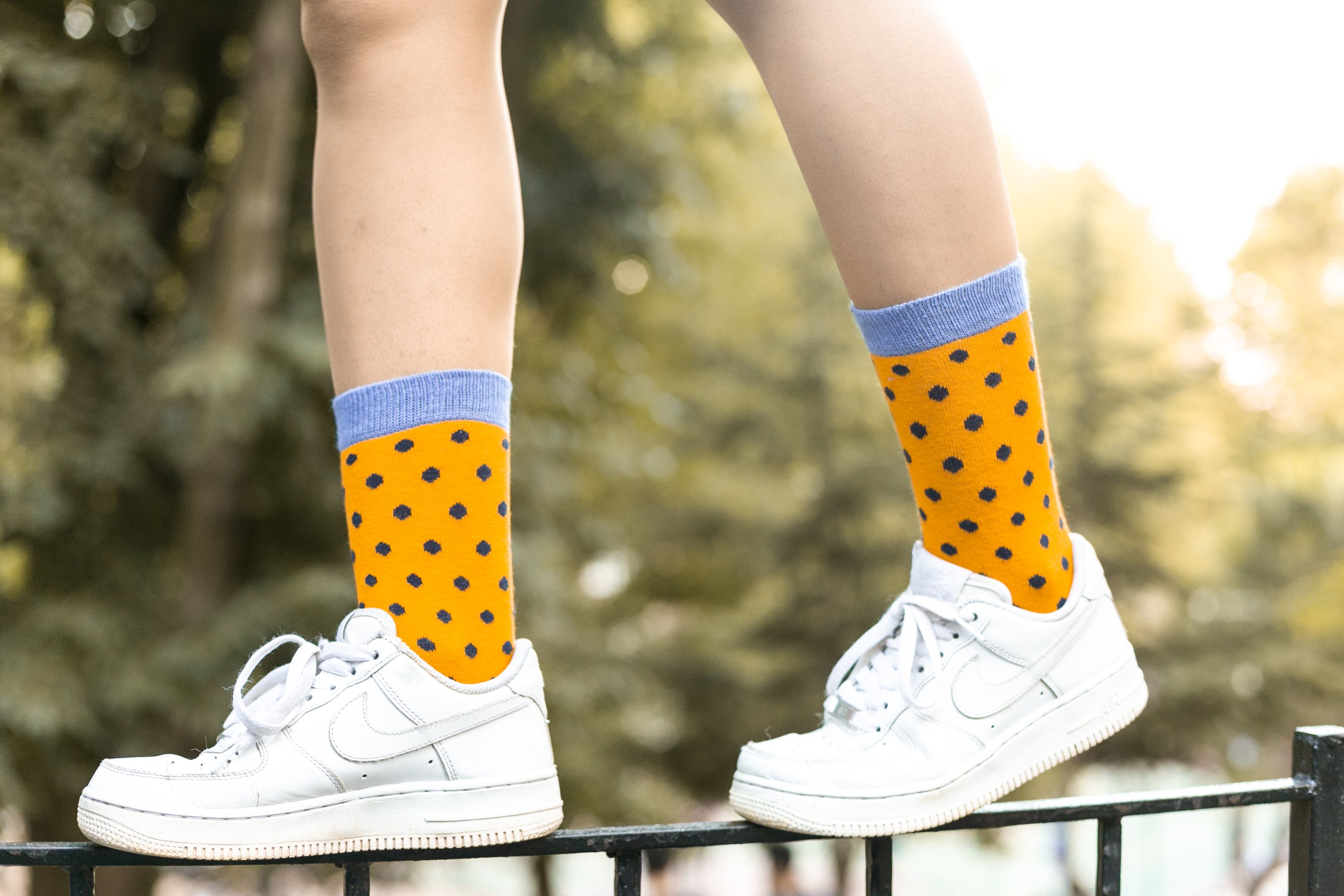 A pair of Women's Apricot Dot Socks featuring a colorful dot pattern, made from soft Turkish cotton for comfort and style.