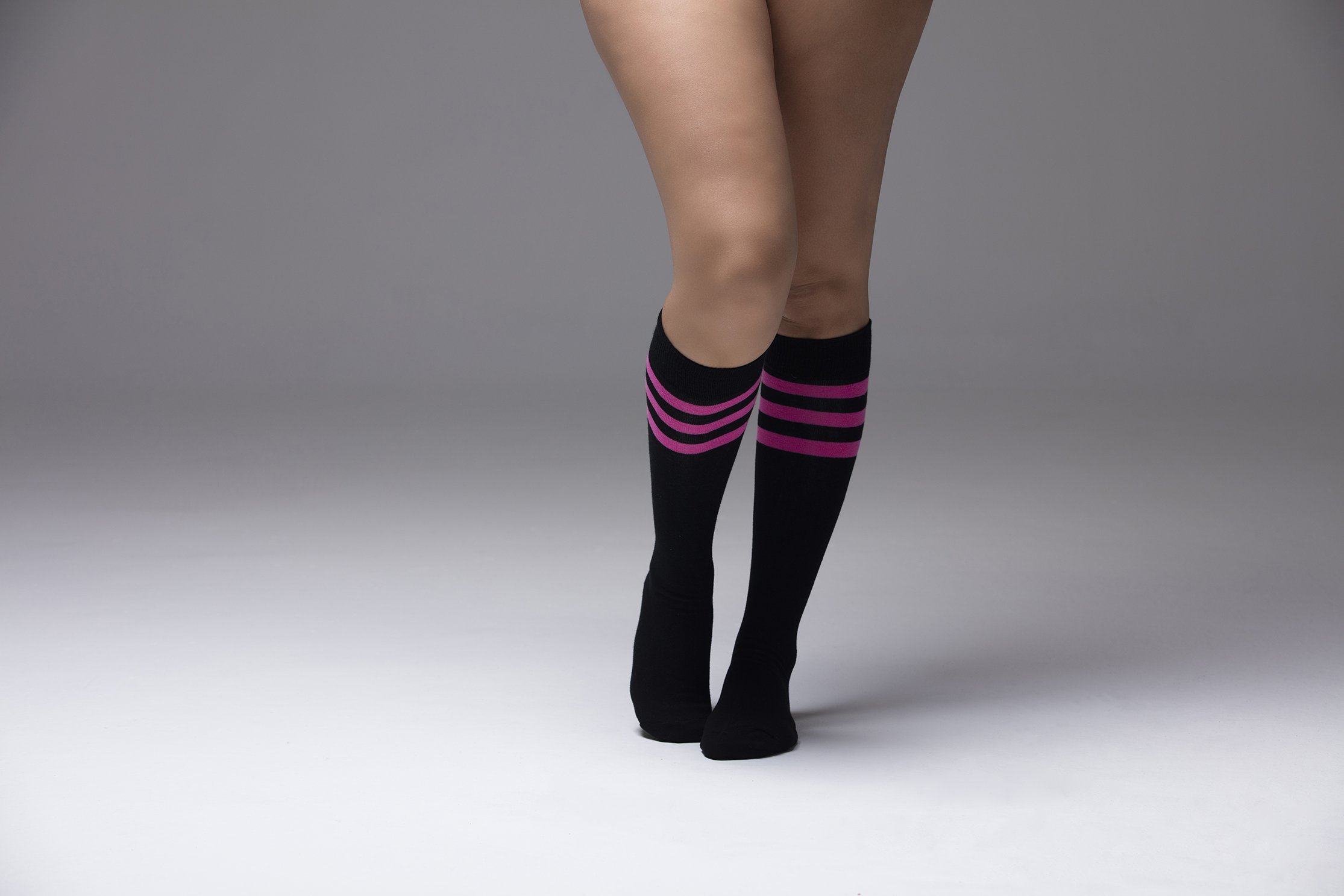 Women's Black Candy Stripe Knee High Socks featuring a trendy design with colorful stripes, perfect for adding style to any outfit.