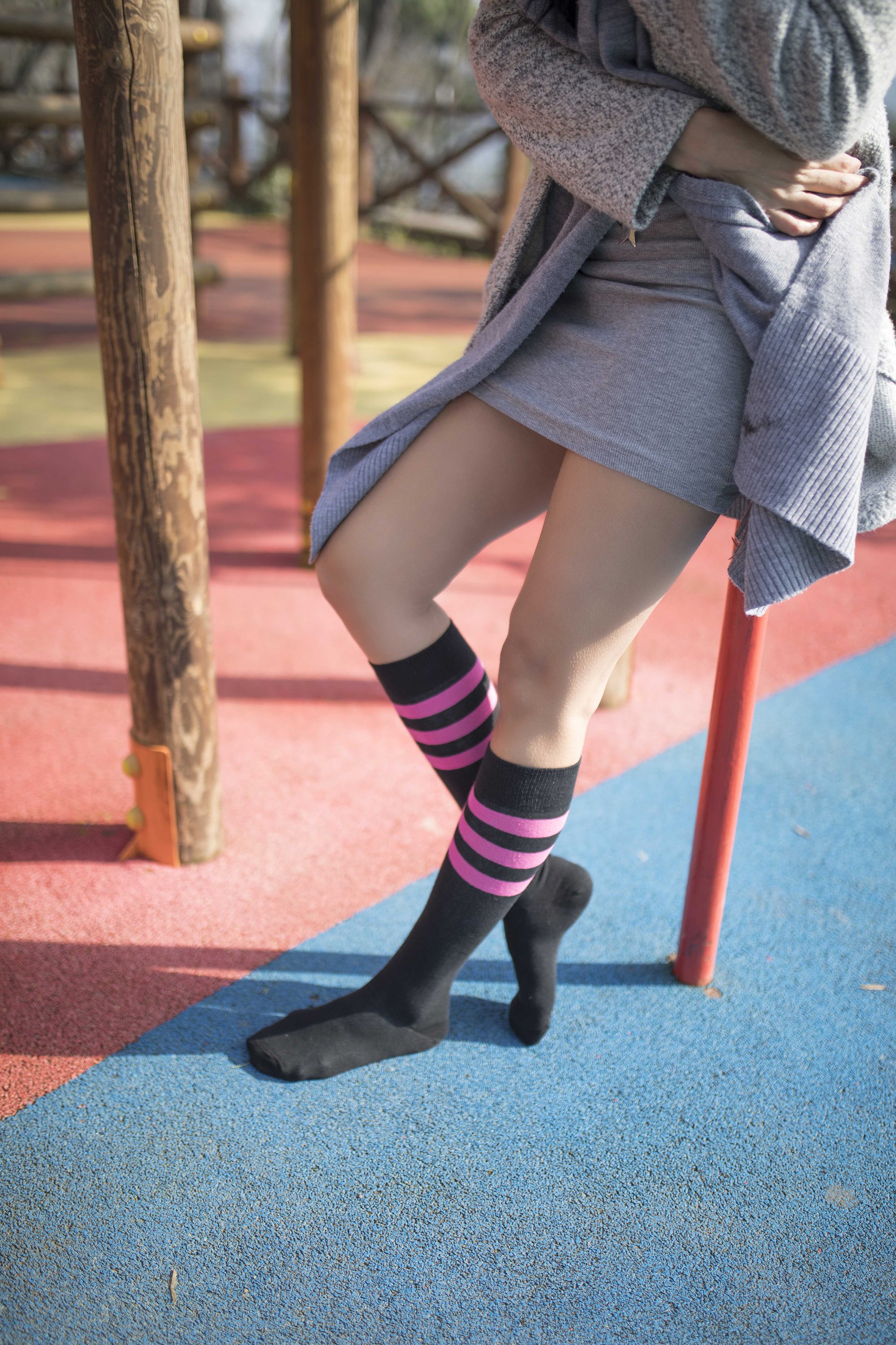 Women's Black Candy Stripe Knee High Socks featuring a trendy design with colorful stripes, perfect for adding style to any outfit.