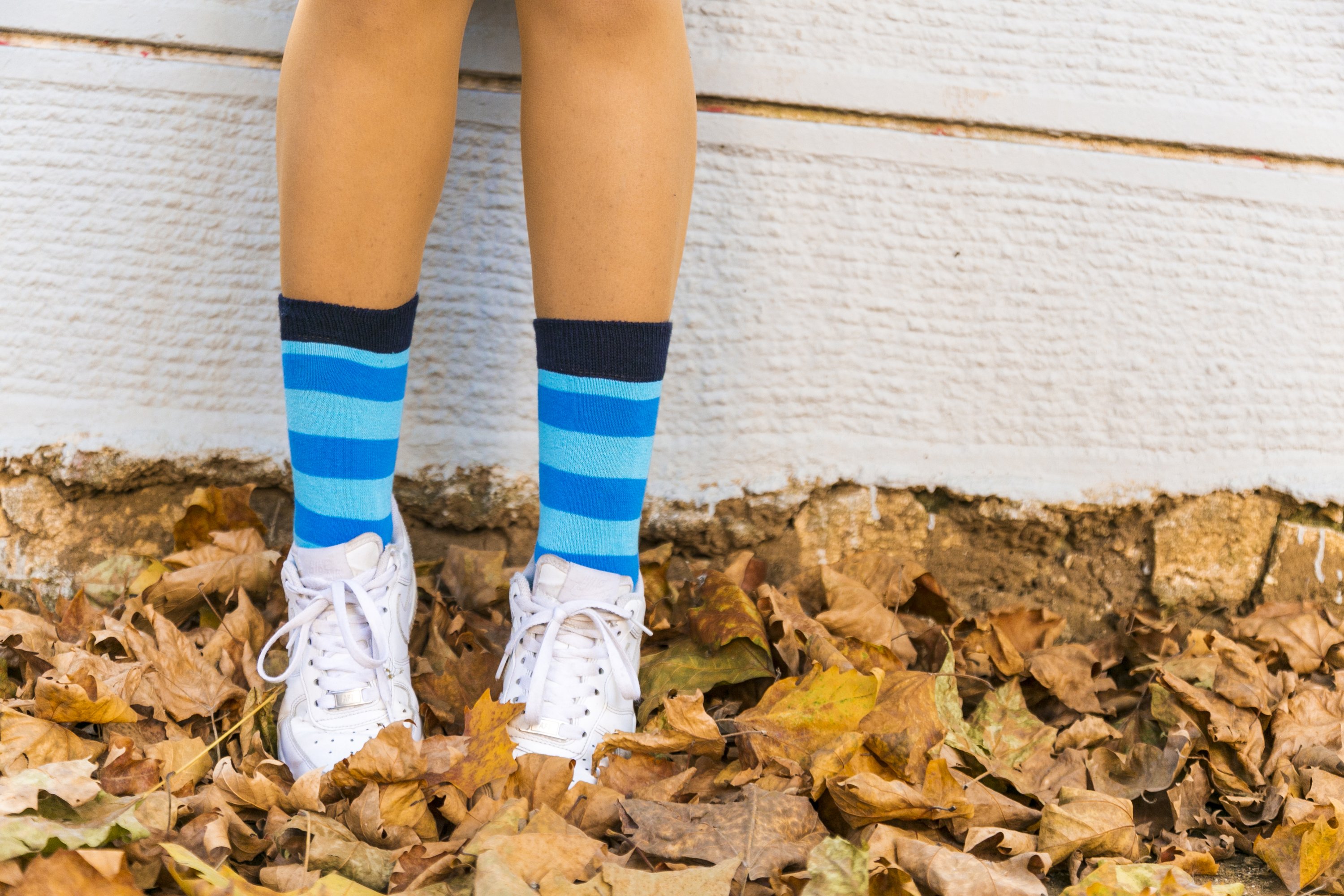 A pair of Women's Black Sky Stripe Socks featuring a vibrant striped design, made from soft Turkish cotton for comfort and style.