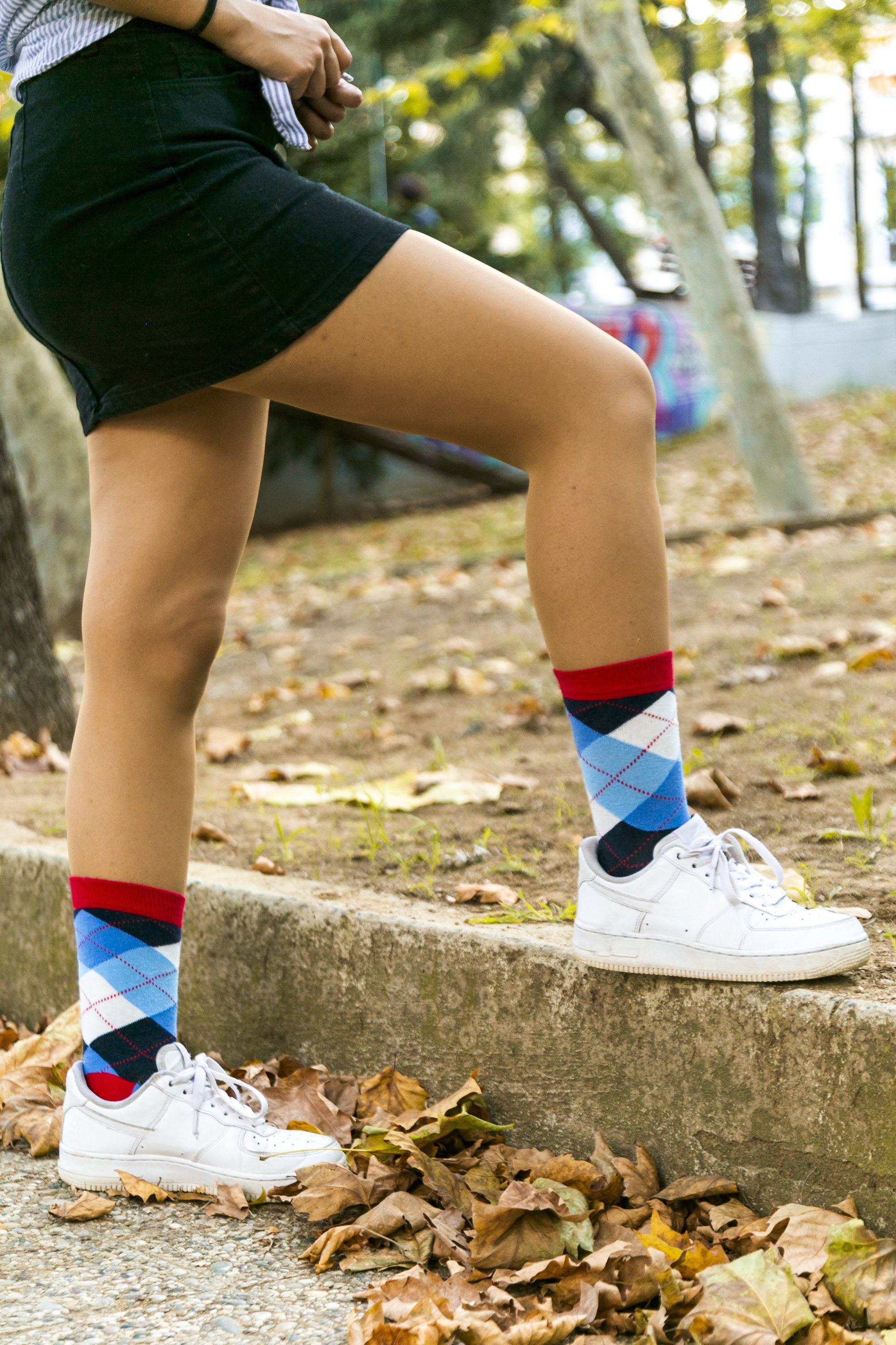 A pair of Women's Cerulean Red Argyle Socks featuring a vibrant pattern, made from soft Turkish cotton for comfort and style.