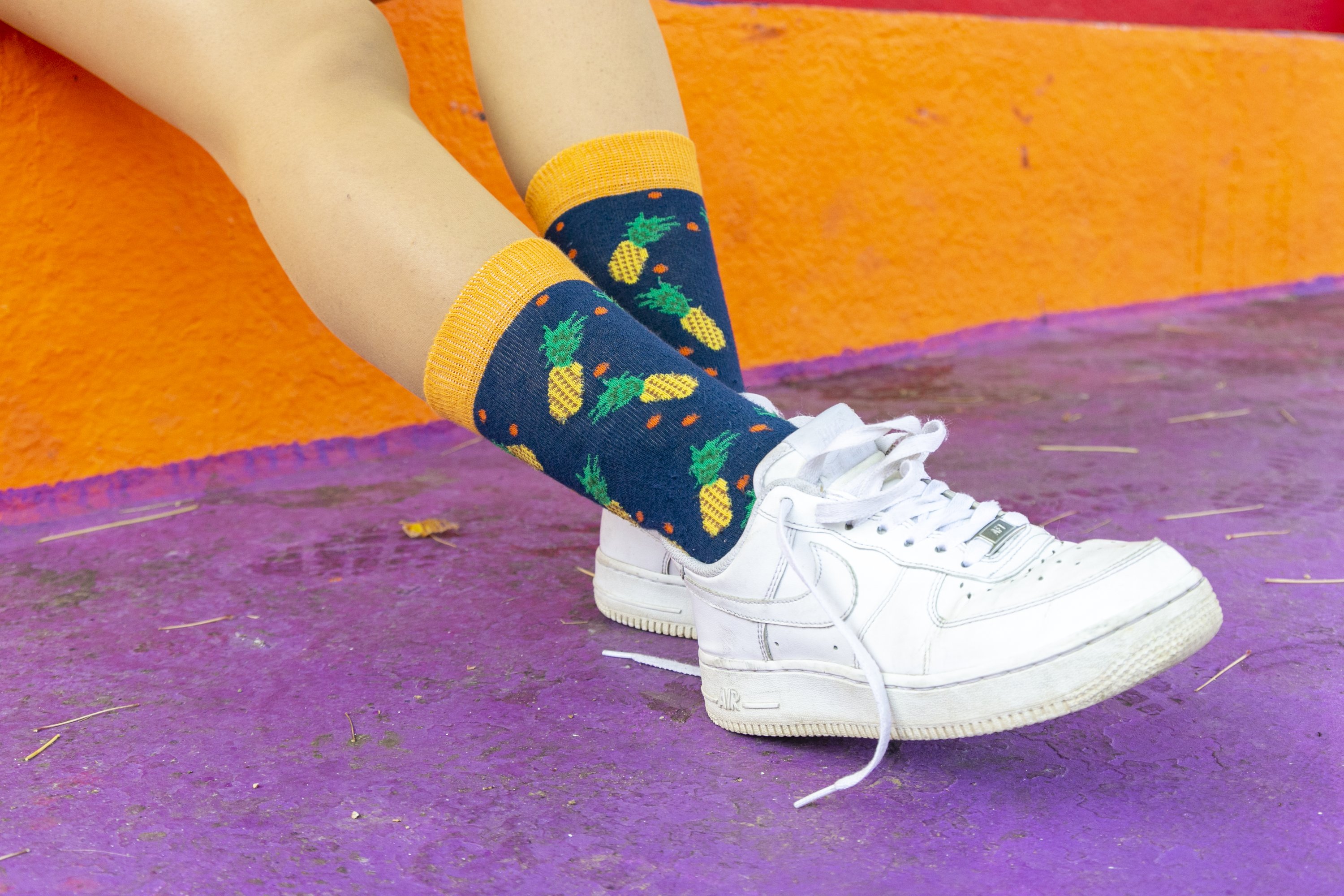 A vibrant set of Women's Cheerful Fruits Socks featuring colorful fruit patterns, perfect for adding fun to any outfit.