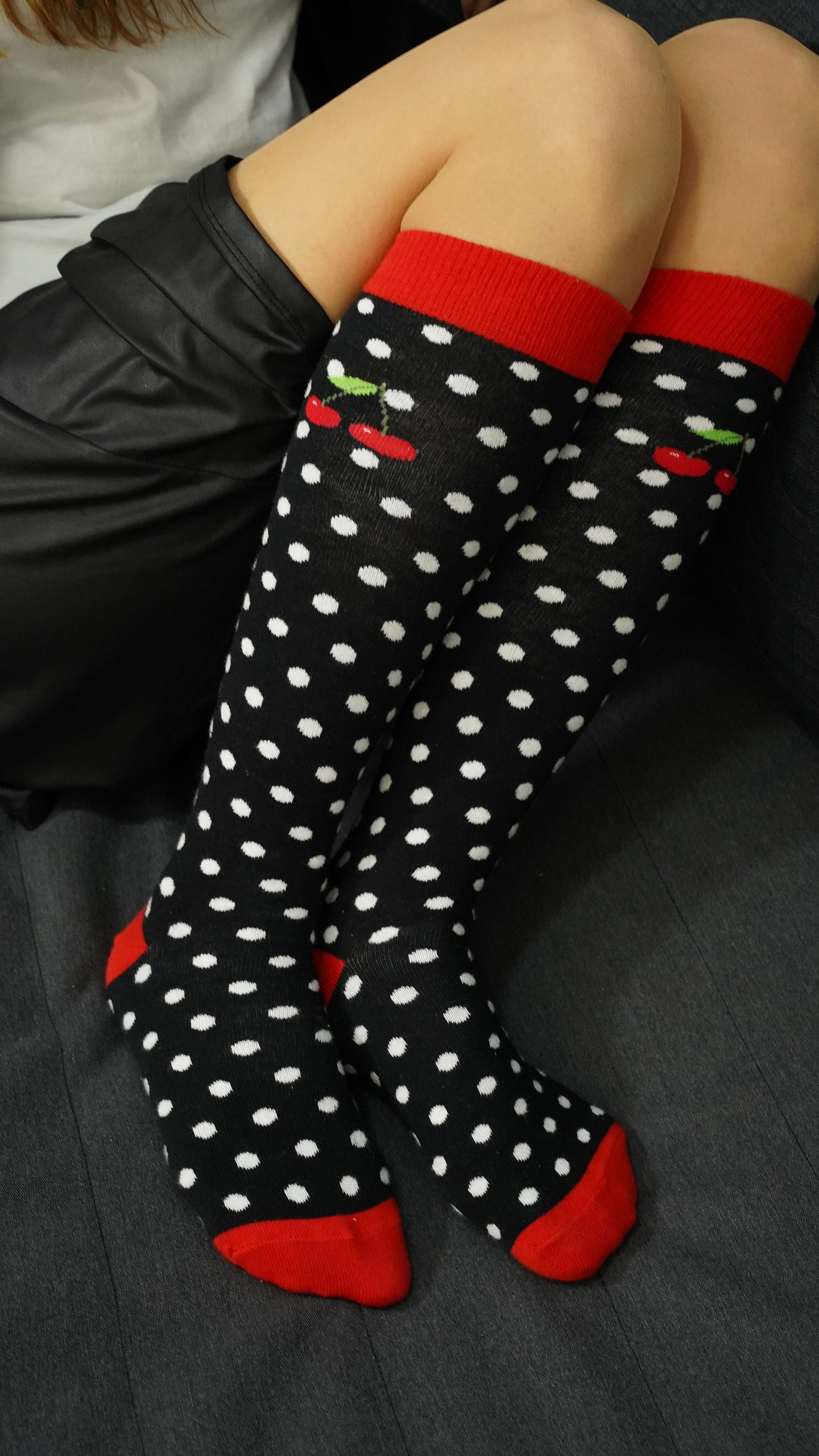 A pair of Women's Cherry Dot Knee High Socks featuring a vibrant cherry dot pattern, made from soft Turkish cotton for comfort and style.