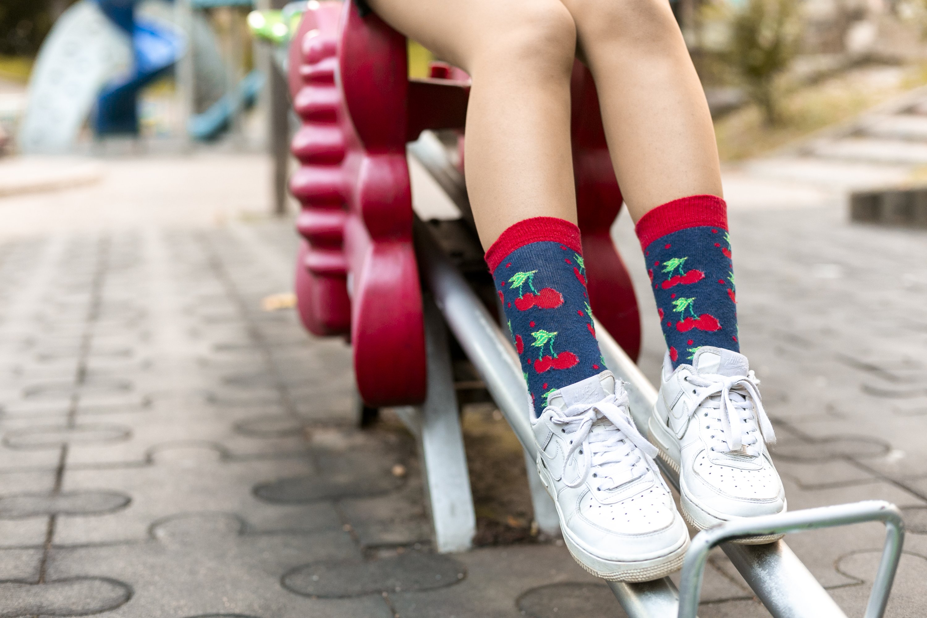 A pair of colorful Women's Cherry Socks featuring a vibrant cherry design, made from soft Turkish cotton for comfort.