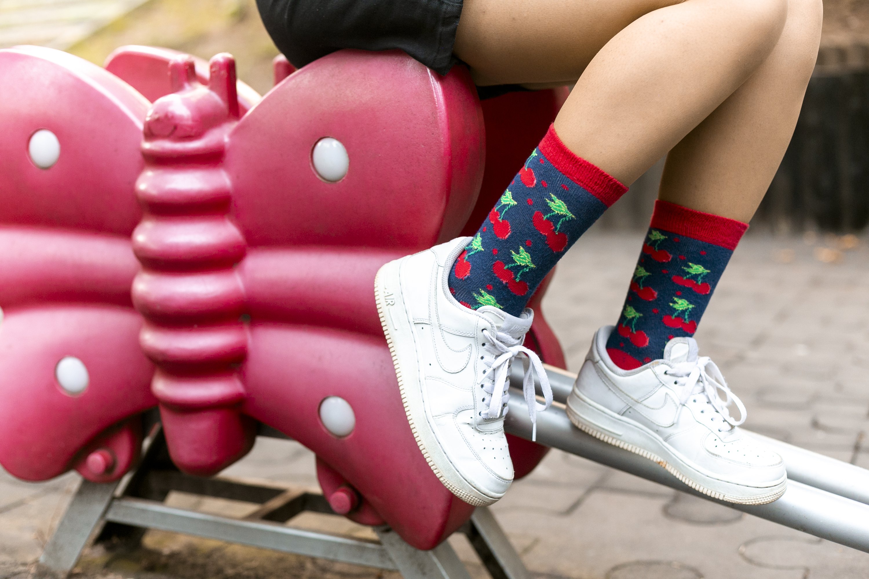 A pair of colorful Women's Cherry Socks featuring a vibrant cherry design, made from soft Turkish cotton for comfort.