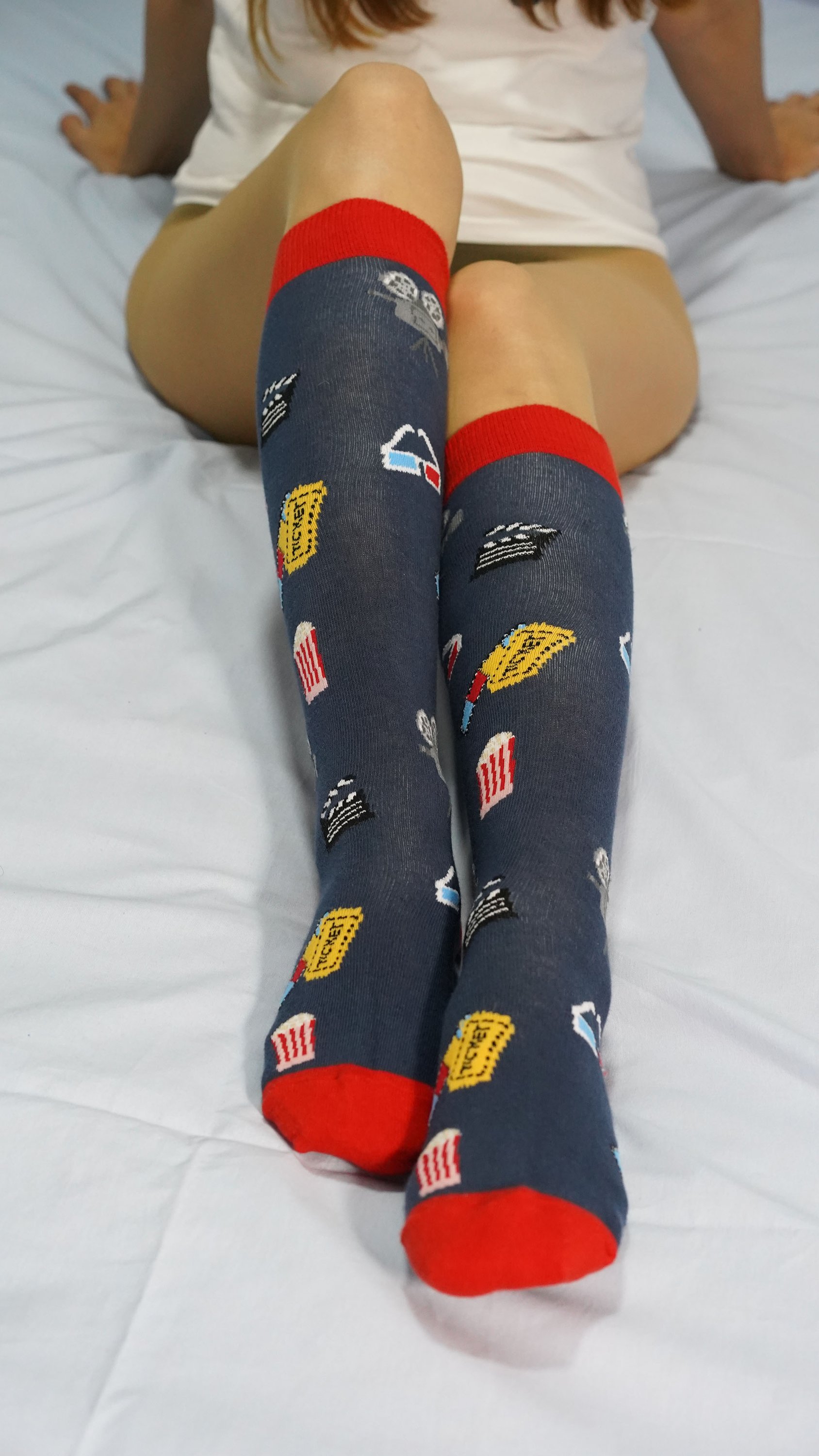 Colorful Women's Cinema Knee High Socks featuring trendy patterns and soft fabric, perfect for stylish outfits.