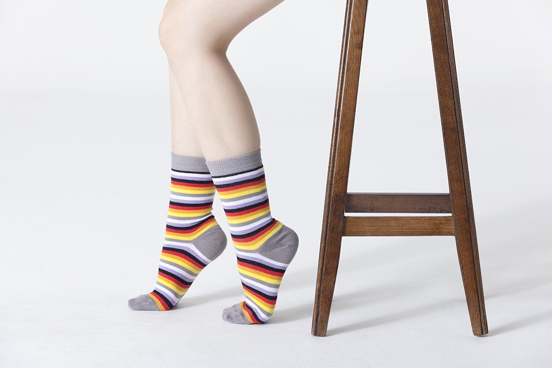 A pair of colorful Women's Cloud Stripe Socks featuring trendy patterns and soft fabric, perfect for adding style to any outfit.