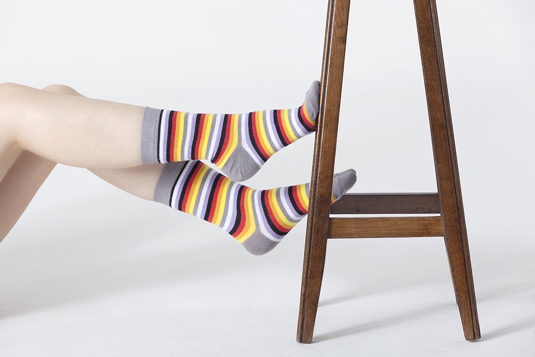 A pair of colorful Women's Cloud Stripe Socks featuring trendy patterns and soft fabric, perfect for adding style to any outfit.