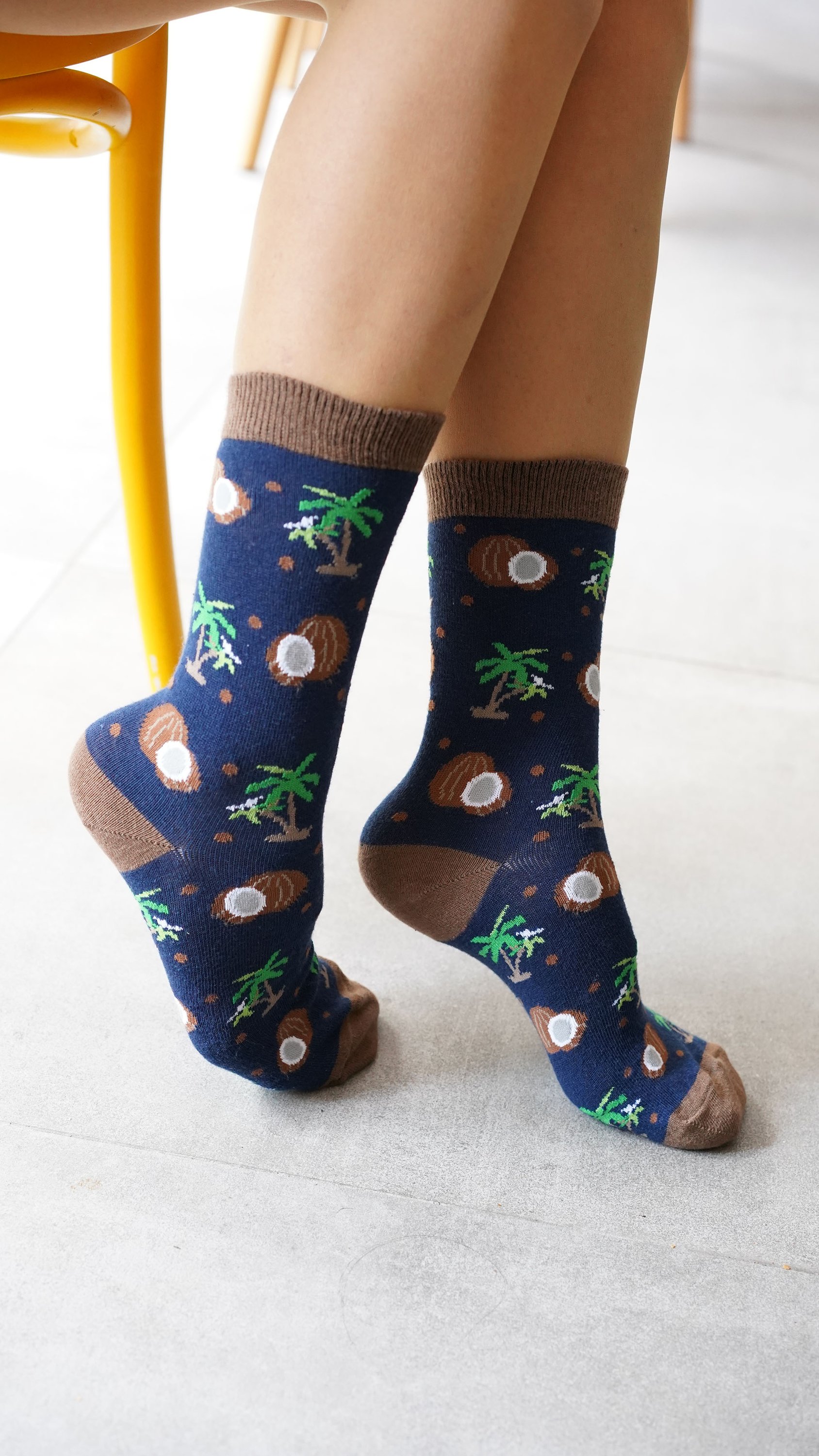 A pair of colorful Women's Coconut Socks made from soft Turkish cotton, featuring trendy patterns and a comfortable fit.