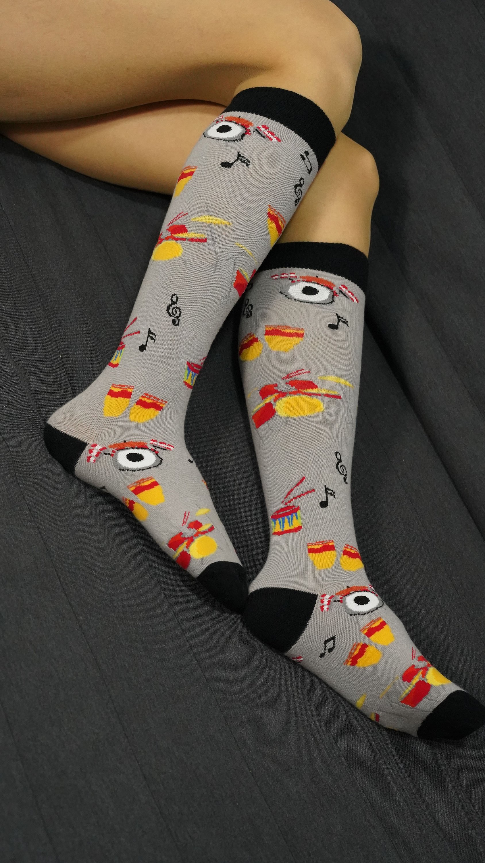 A pair of colorful Women's Drums Knee High Socks featuring trendy patterns and a comfortable fit, perfect for stylish outfits.