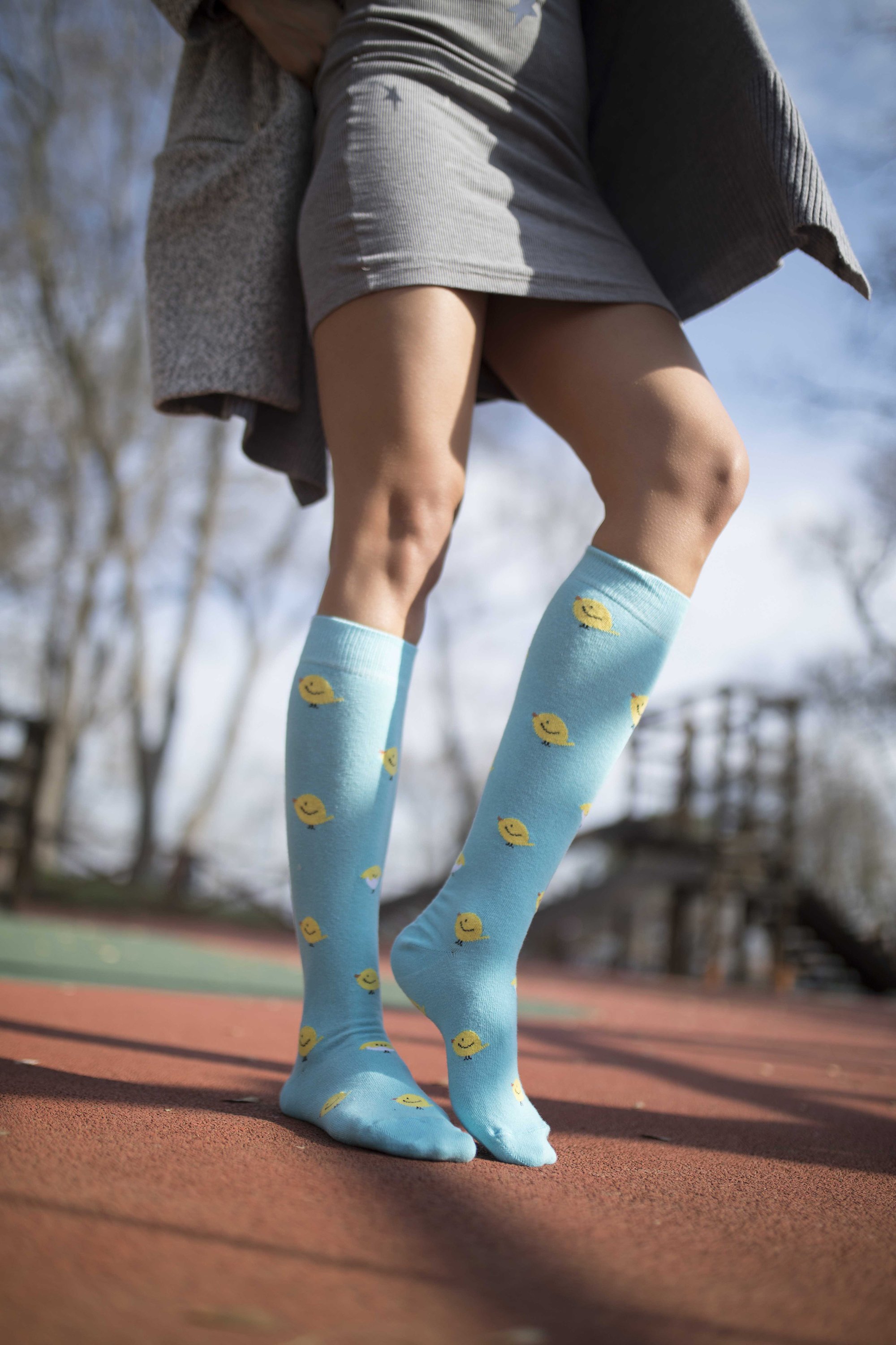 Colorful Women's Duck Knee High Socks displayed with vibrant patterns and designs, showcasing their trendy style and comfort.