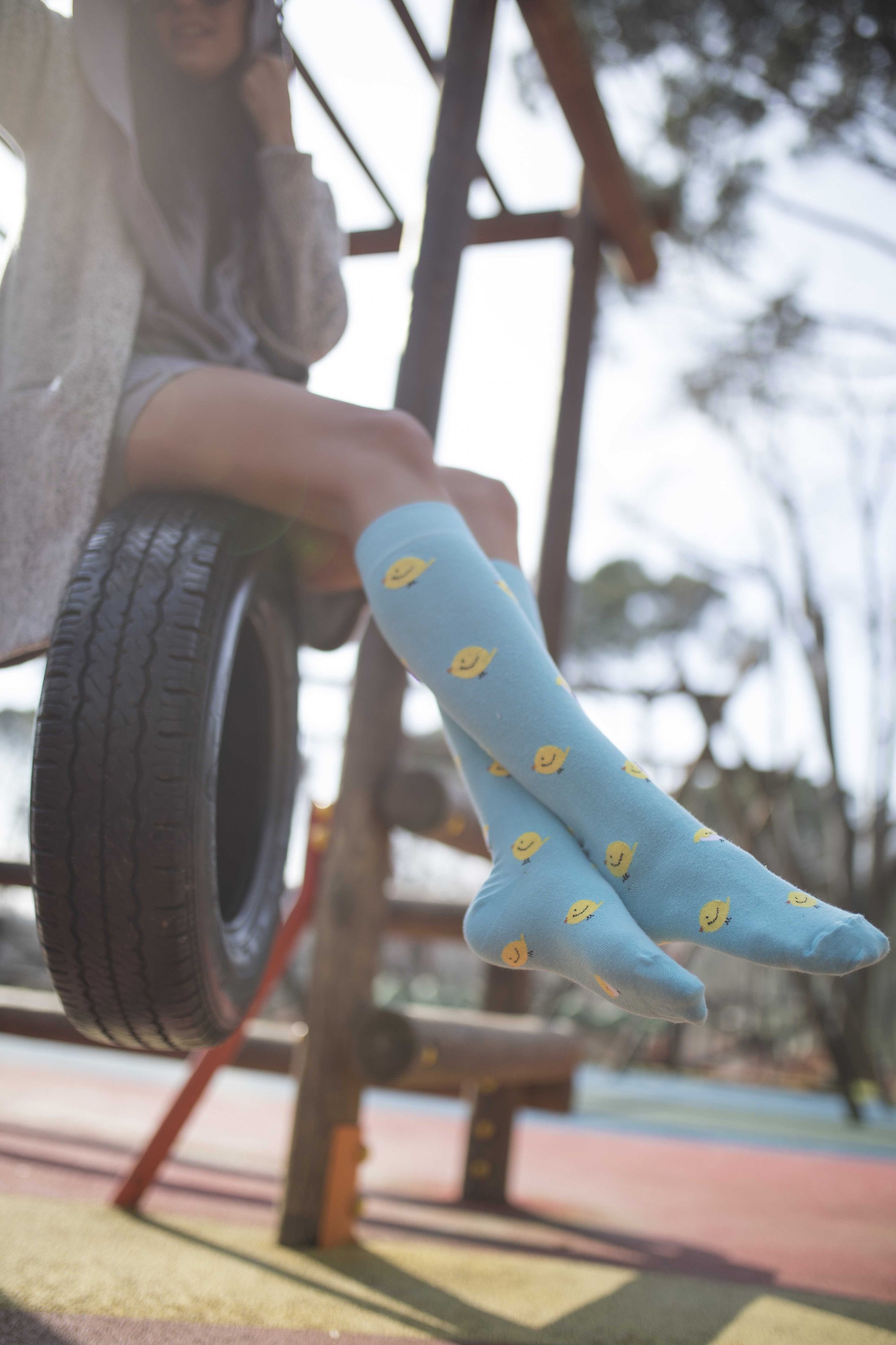 Colorful Women's Duck Knee High Socks displayed with vibrant patterns and designs, showcasing their trendy style and comfort.