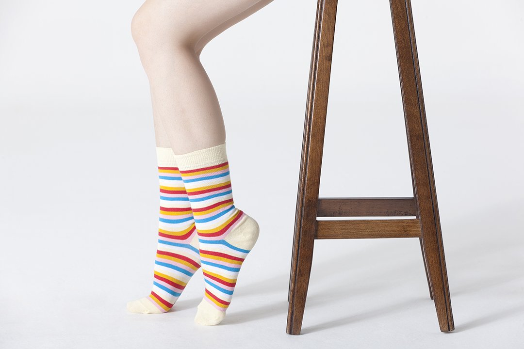 Colorful Women's Eggnog Stripe Socks made from soft cotton, featuring a trendy design perfect for adding flair to any outfit.