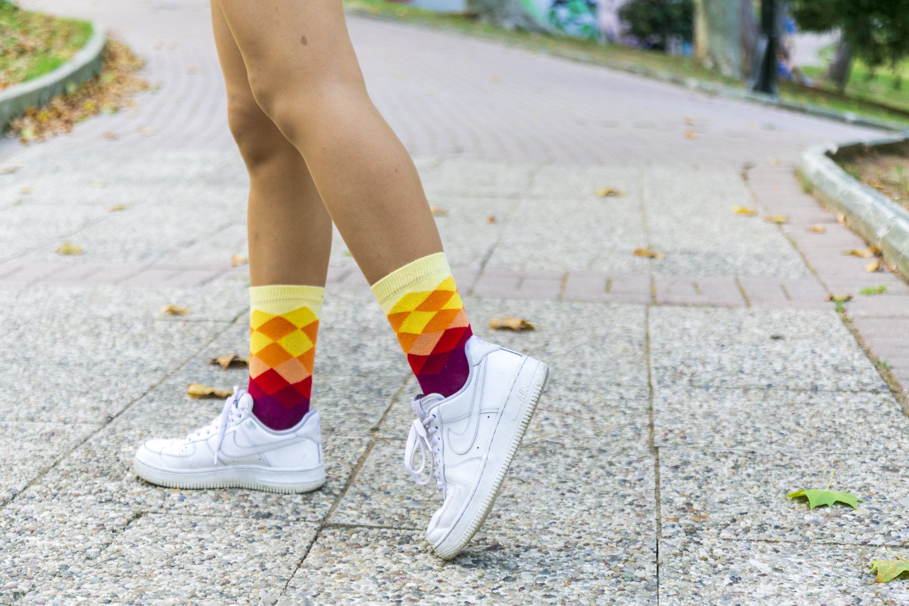 A pair of Women's Flame Diamond Socks featuring colorful and trendy patterns, made from soft Turkish cotton for comfort.