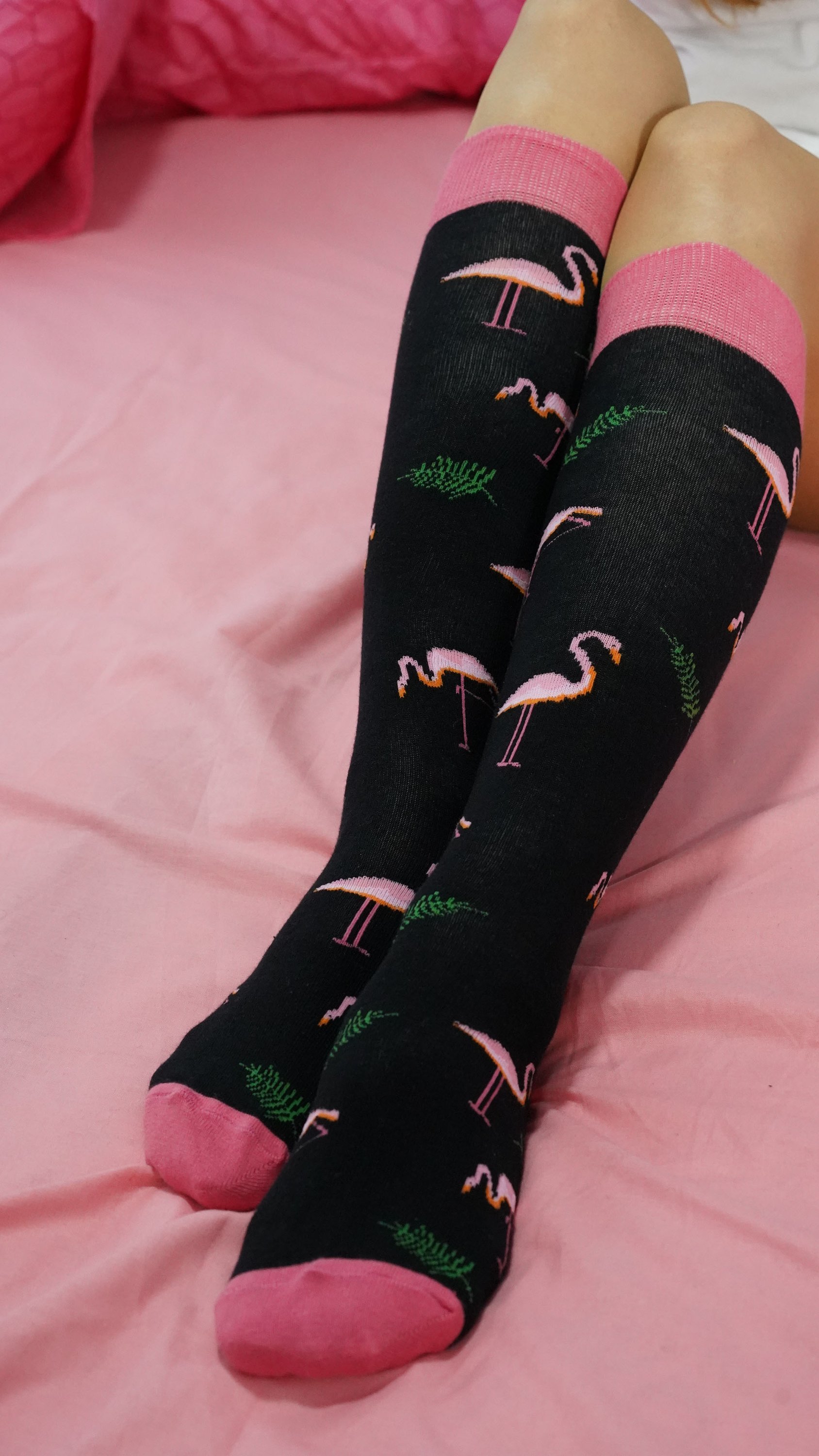 A pair of colorful Women's Flamingo Knee High Socks featuring a vibrant flamingo design, perfect for adding a fun touch to any outfit.