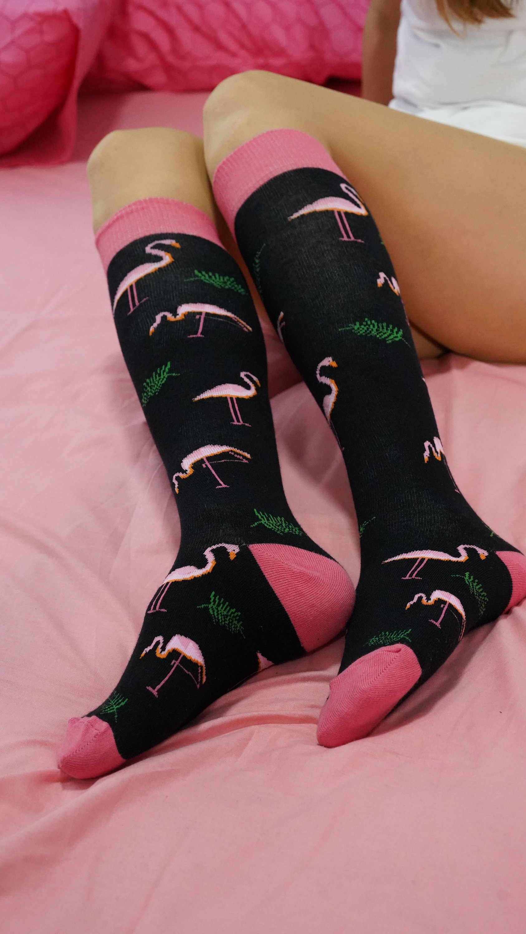 A pair of colorful Women's Flamingo Knee High Socks featuring a vibrant flamingo design, perfect for adding a fun touch to any outfit.