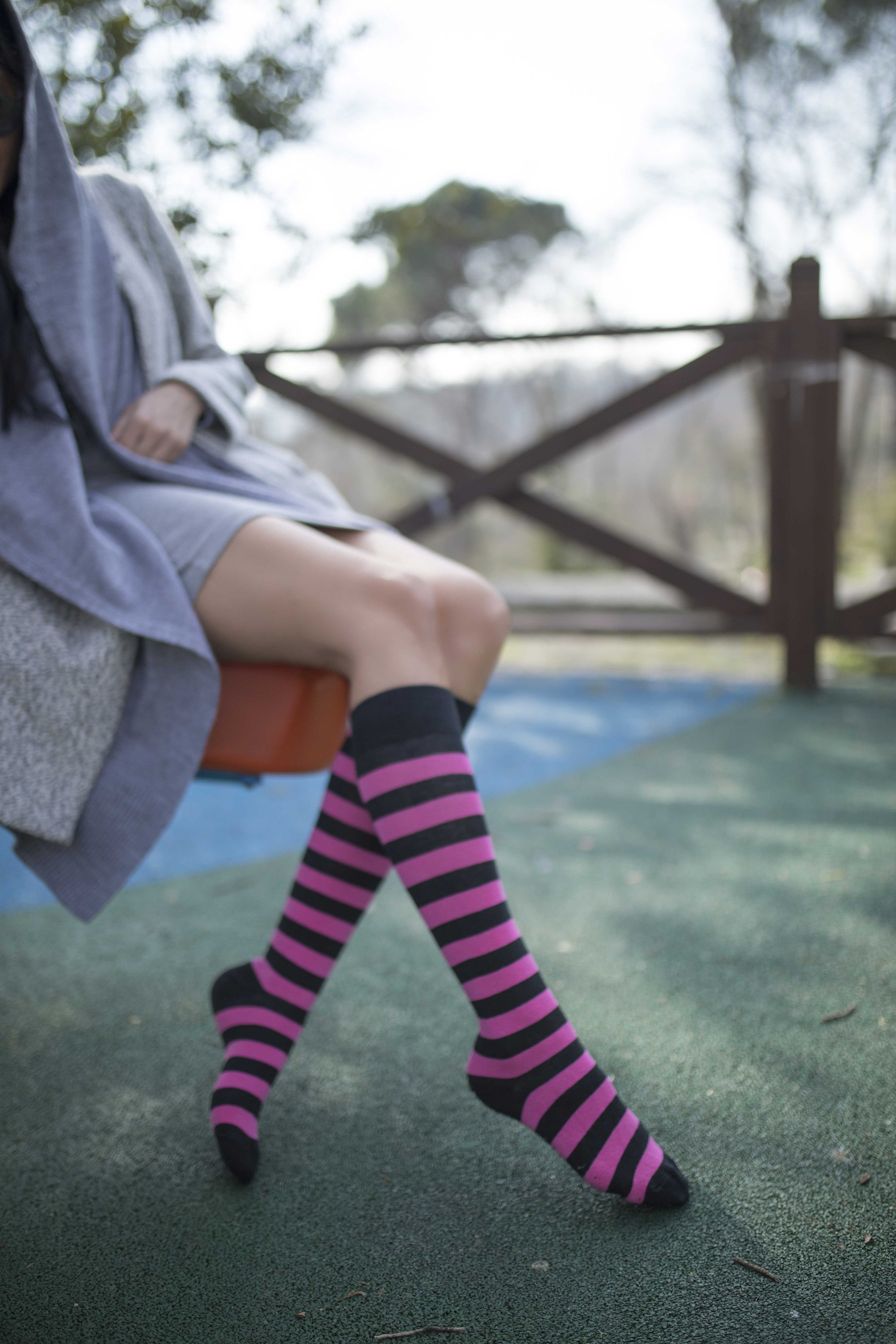 Colorful Women's Flamingo Stripe Knee High Socks featuring a vibrant design, perfect for adding a fun touch to any outfit.