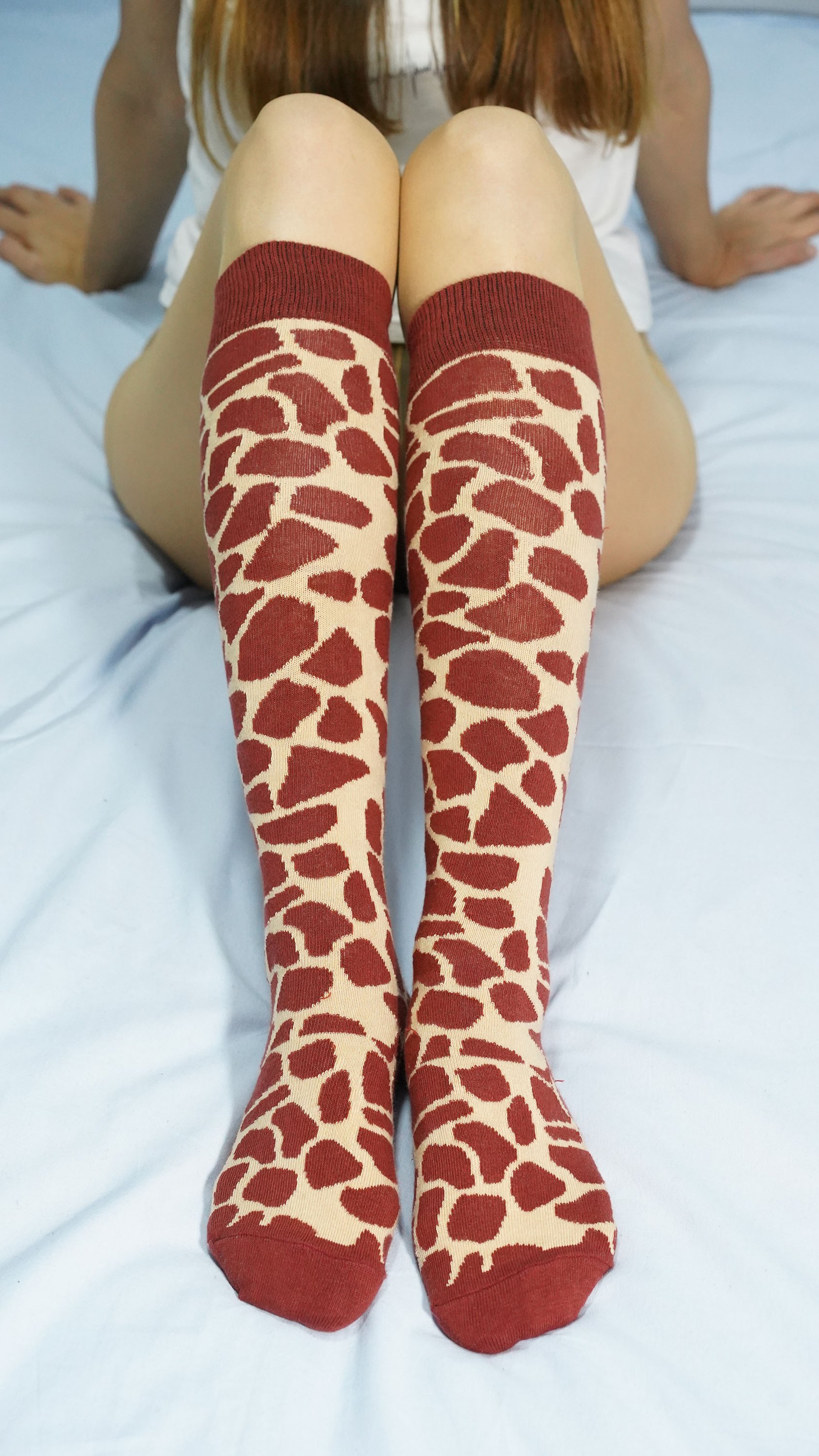 Colorful Women's Giraffe Knee High Socks featuring a playful giraffe pattern, perfect for adding a fun touch to any outfit.