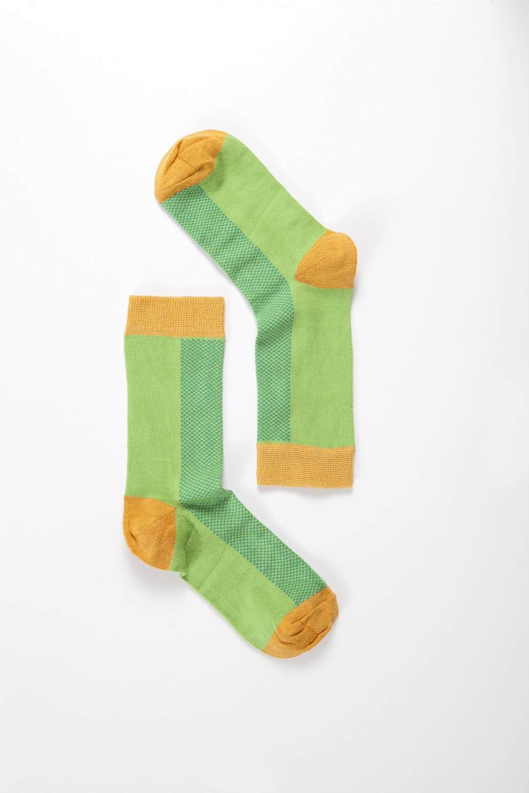 A pair of vibrant Women's Green Marmalade Socks featuring colorful patterns, made from soft Turkish cotton for comfort and style.