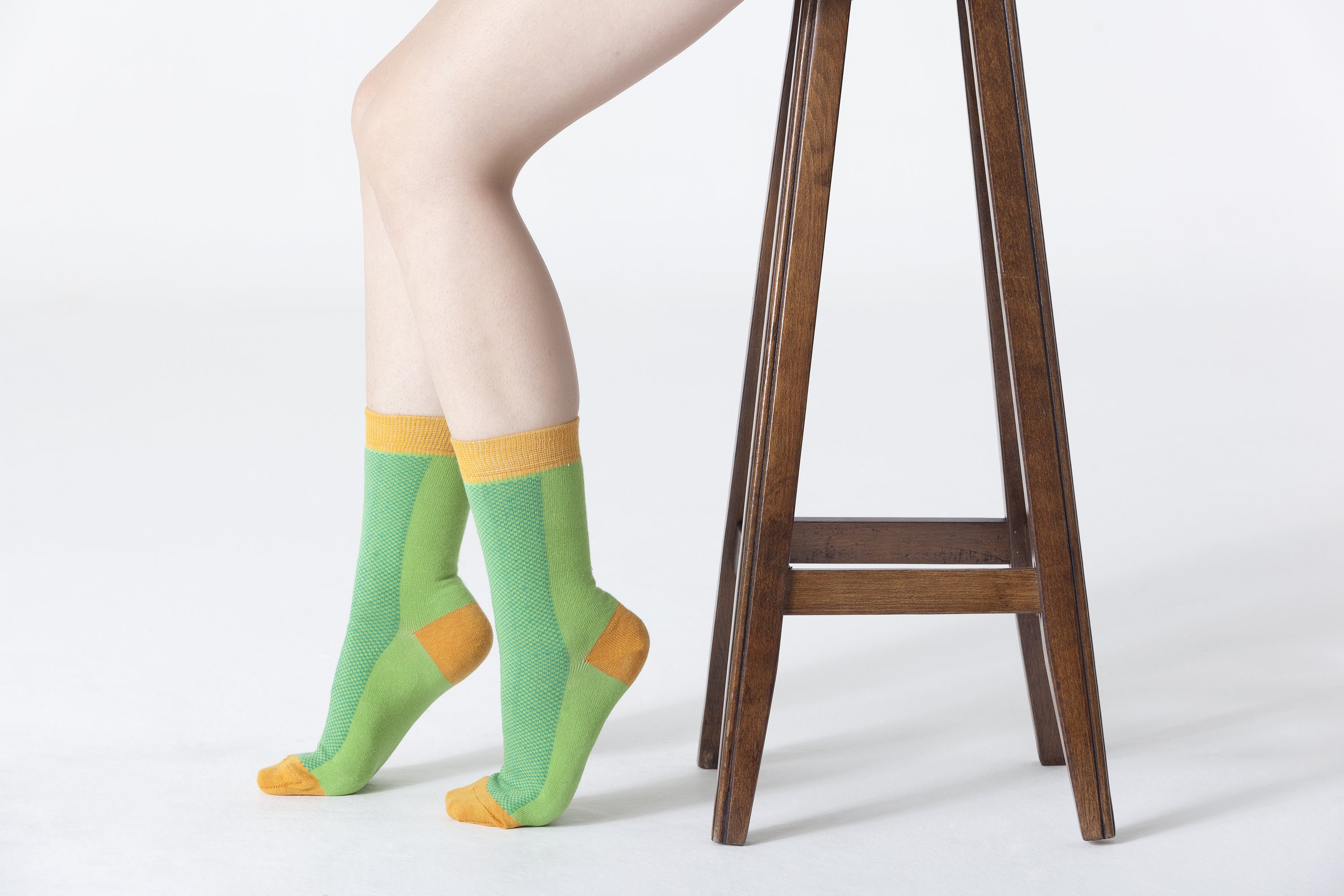 A pair of vibrant Women's Green Marmalade Socks featuring colorful patterns, made from soft Turkish cotton for comfort and style.