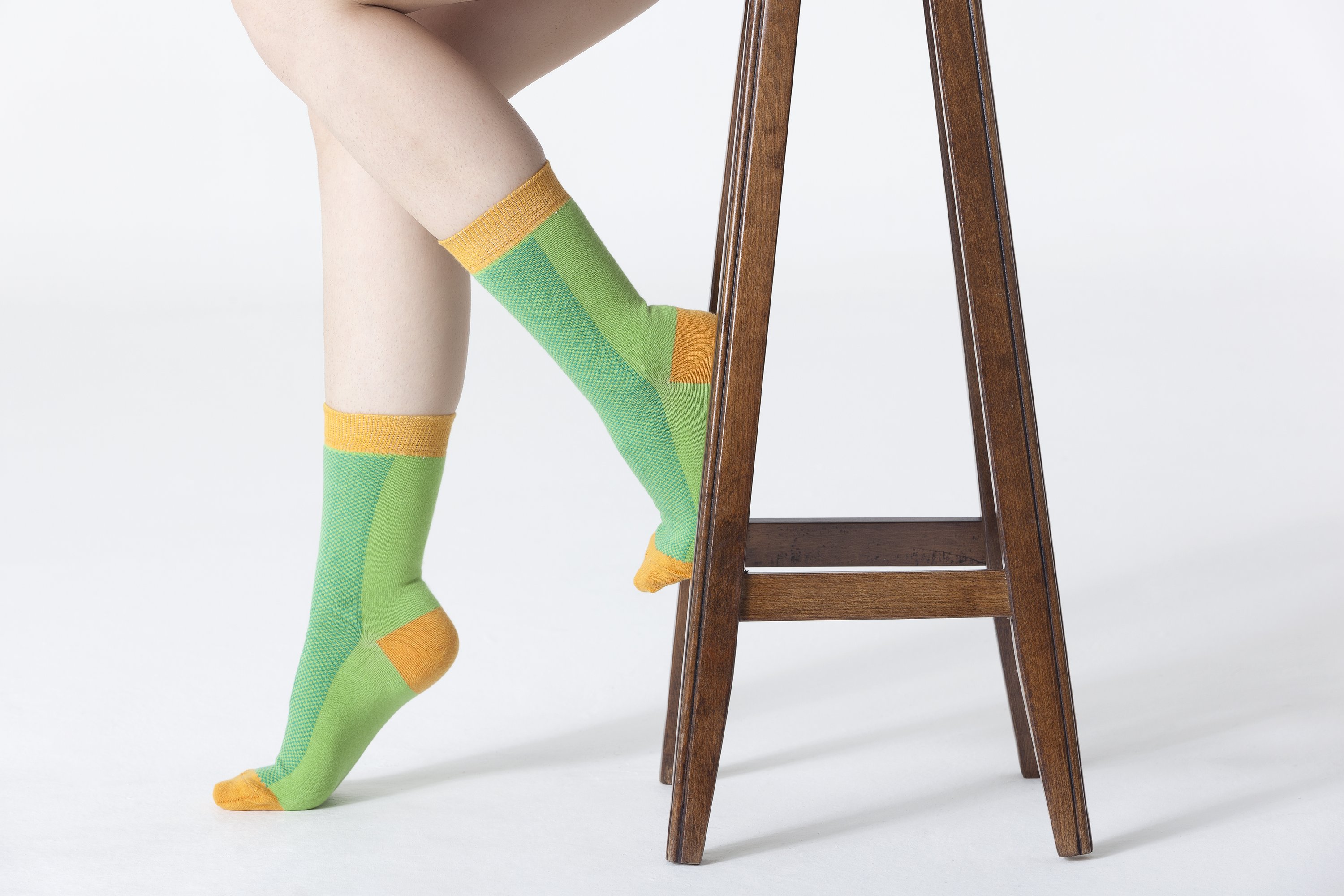 A pair of vibrant Women's Green Marmalade Socks featuring colorful patterns, made from soft Turkish cotton for comfort and style.