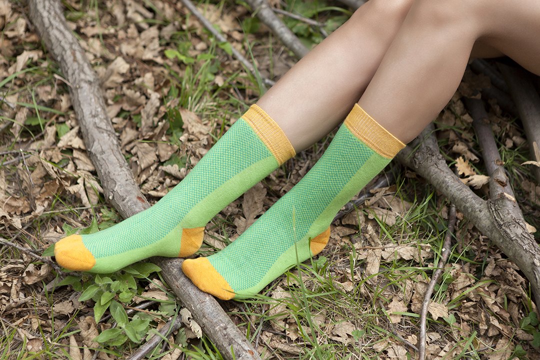 A pair of vibrant Women's Green Marmalade Socks featuring colorful patterns, made from soft Turkish cotton for comfort and style.