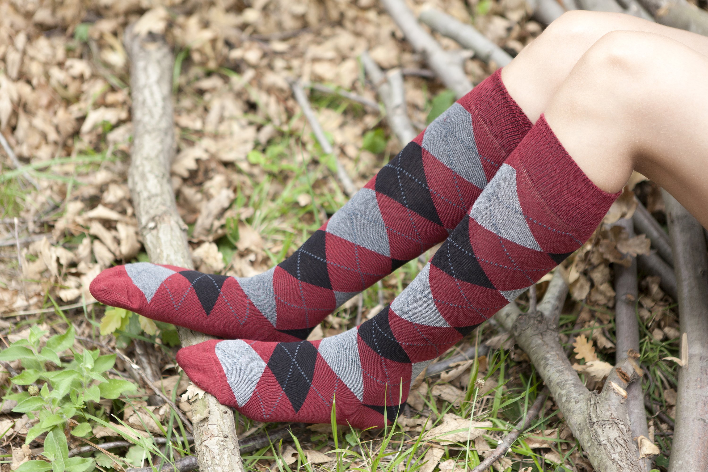 A vibrant set of Women's High-Class Argyle Knee High Socks featuring colorful patterns and a soft texture, perfect for stylish comfort.