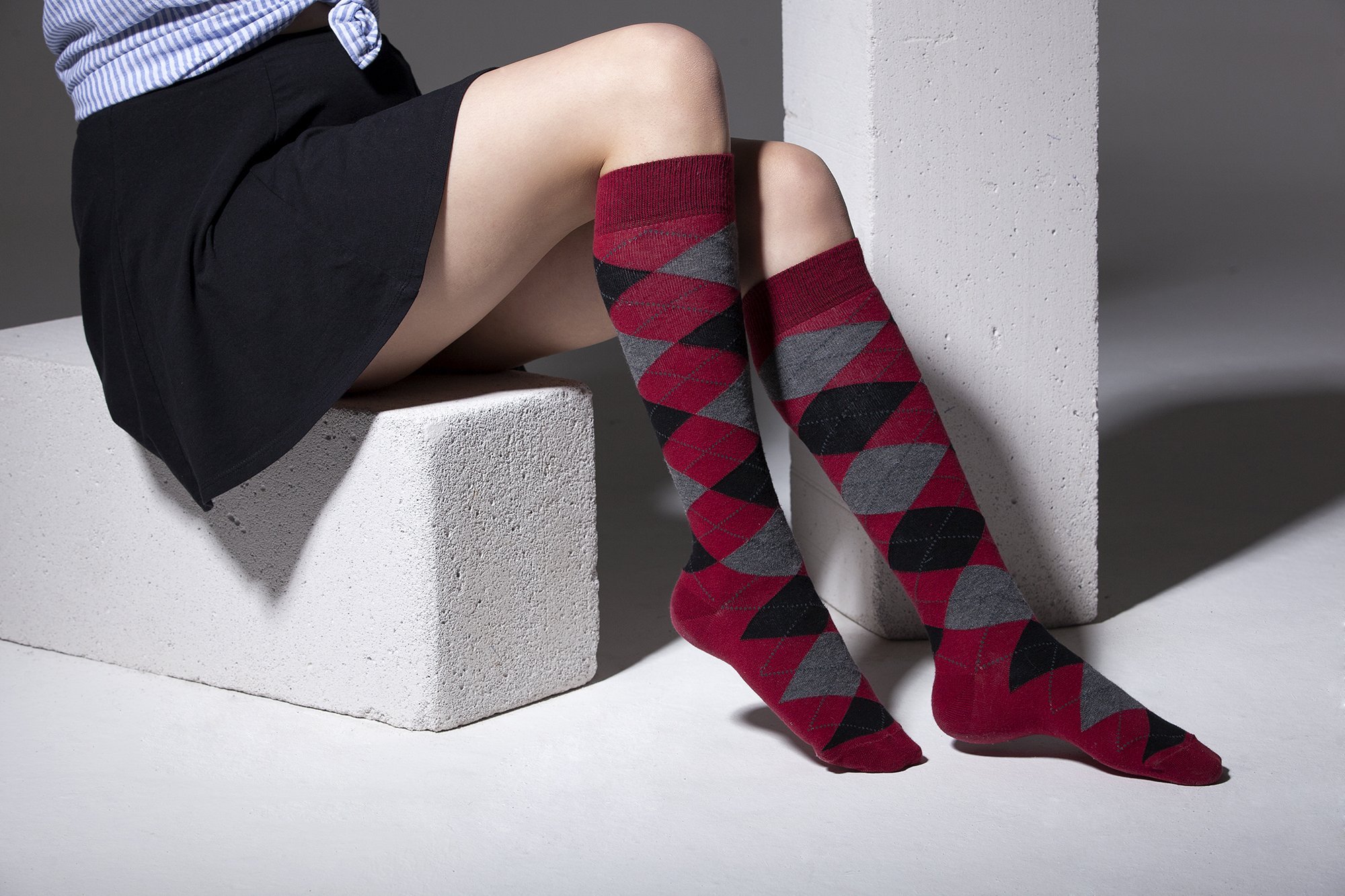 A vibrant set of Women's High-Class Argyle Knee High Socks featuring colorful patterns and a soft texture, perfect for stylish comfort.