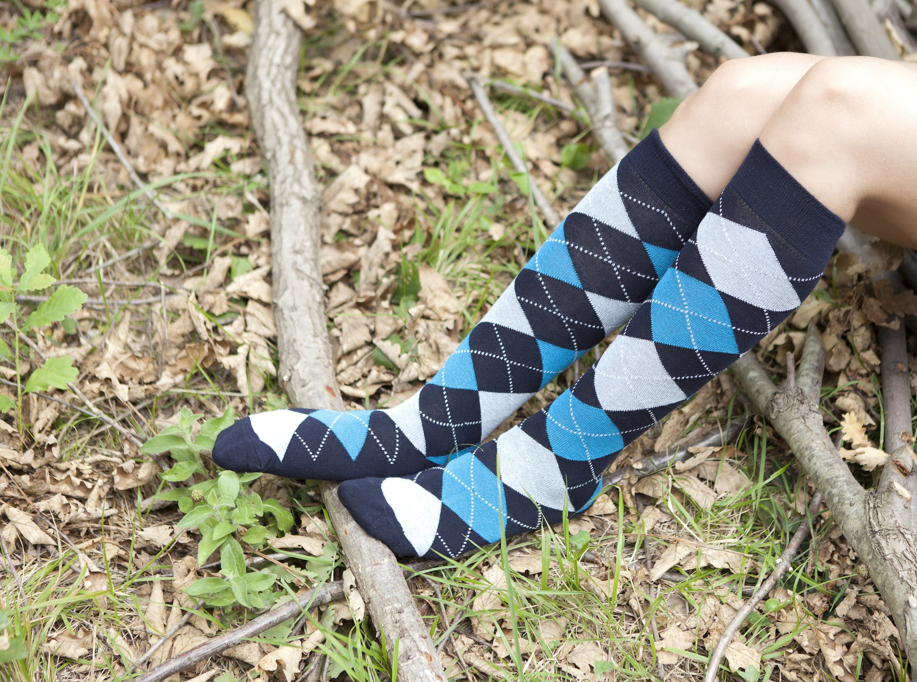 A vibrant set of Women's High-Class Argyle Knee High Socks featuring colorful patterns and a soft texture, perfect for stylish comfort.