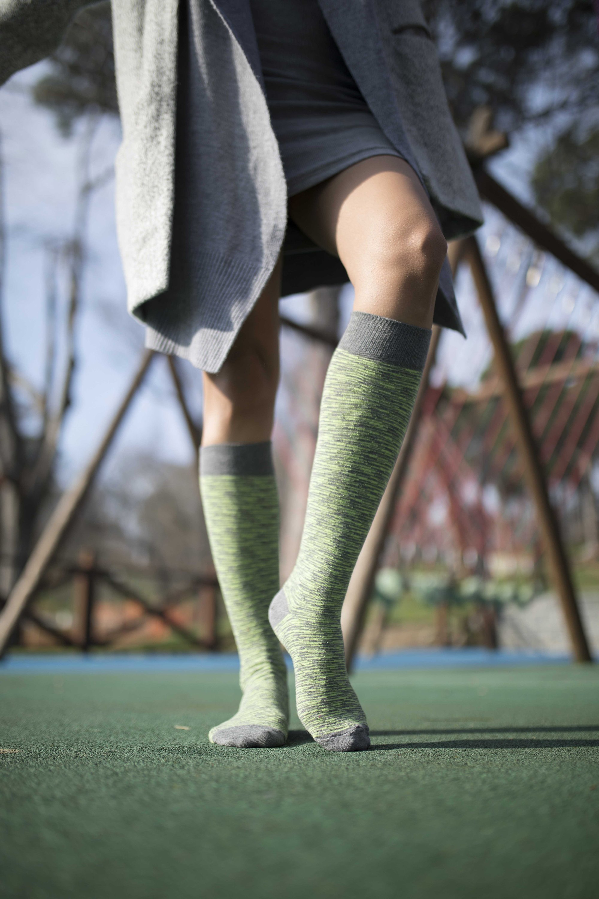 A pair of vibrant Women's Lime Grizzled Stripe Knee High Socks showcasing a colorful striped pattern, perfect for adding flair to any outfit.