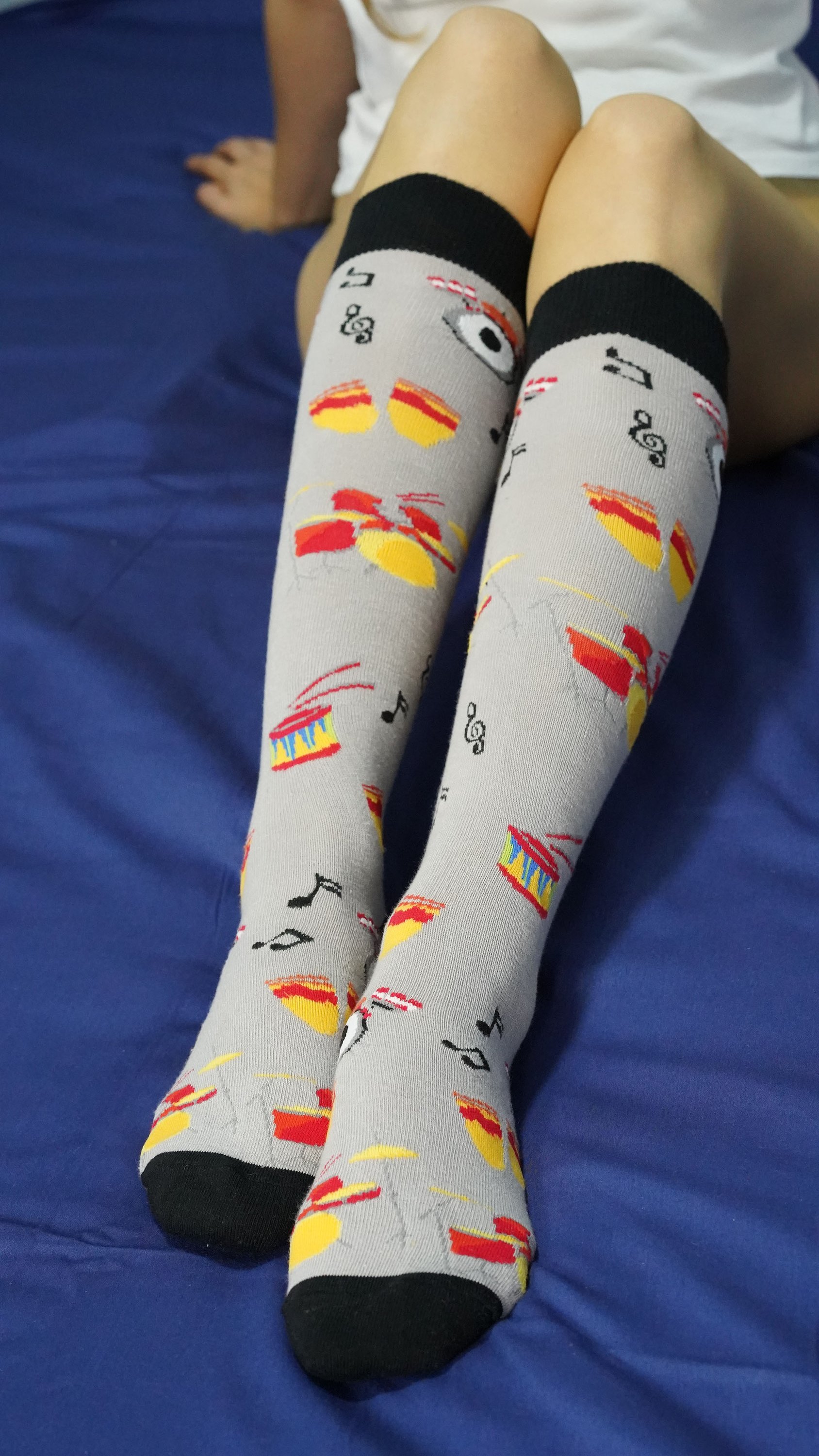 A vibrant set of Women's Music Knee High Socks featuring colorful patterns and designs, perfect for adding style to any outfit.