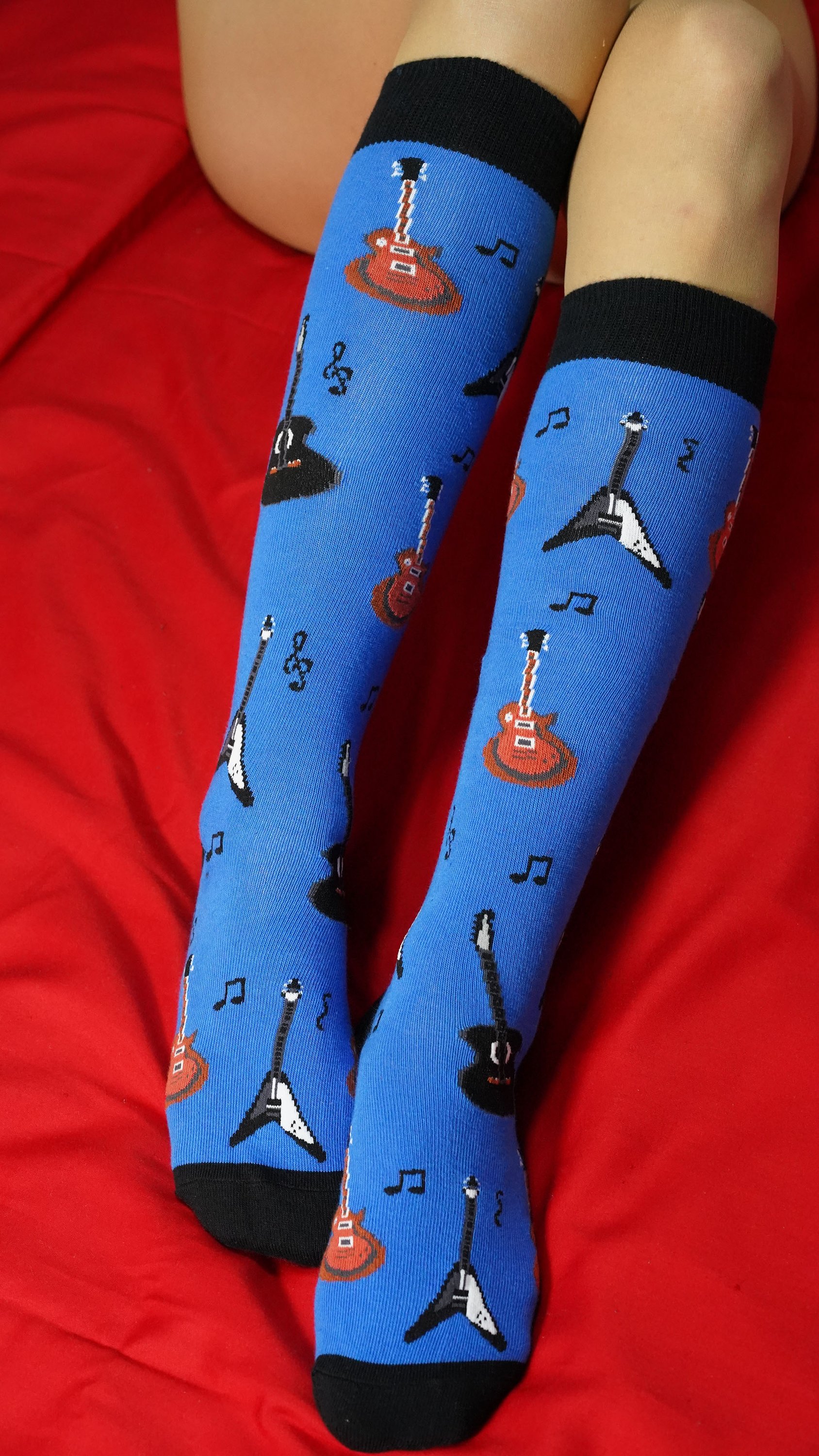 A vibrant set of Women's Music Knee High Socks featuring colorful patterns and designs, perfect for adding style to any outfit.