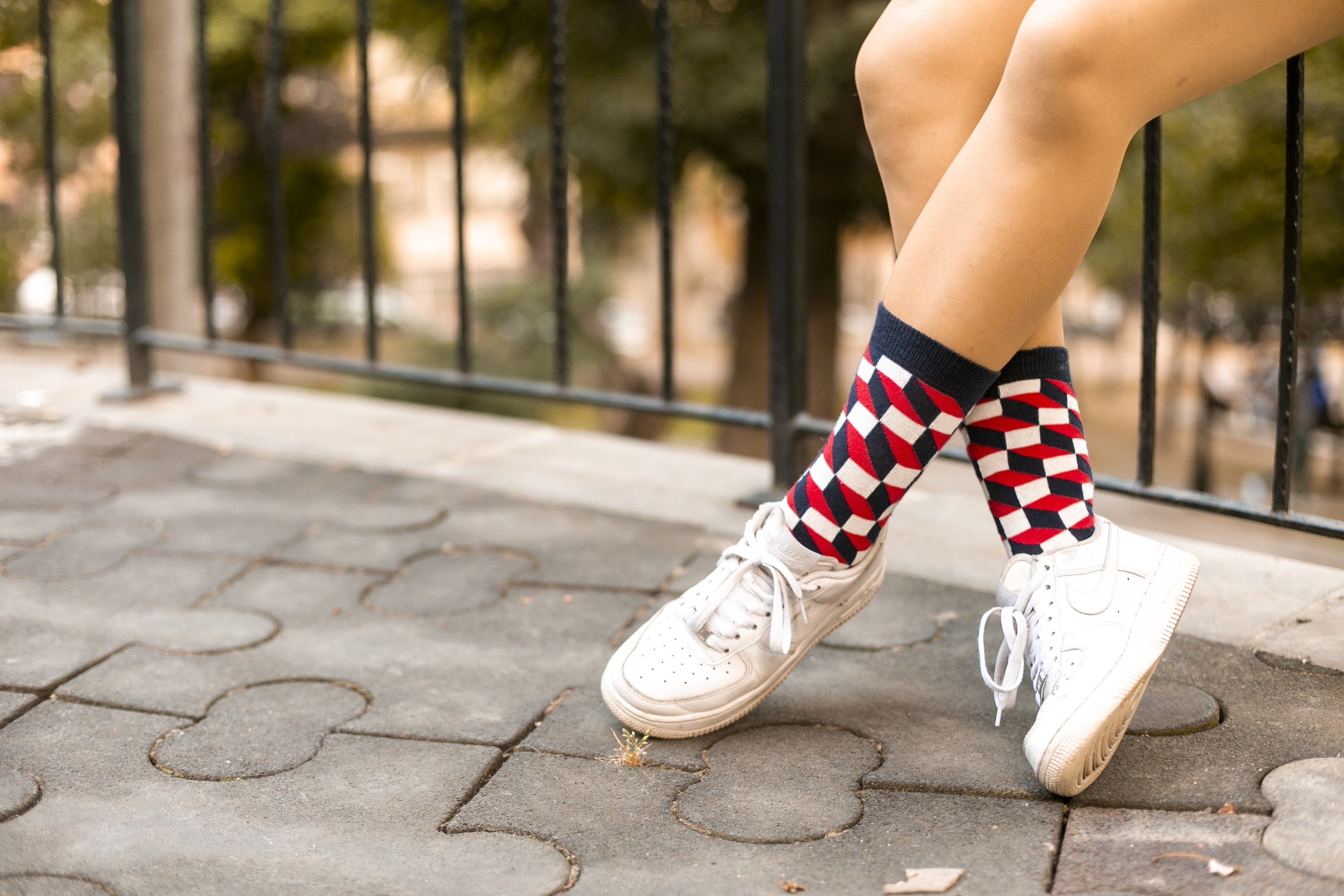 A pair of Women's Navy-Red Block Socks featuring a vibrant block design, made from soft Turkish cotton for comfort and style.