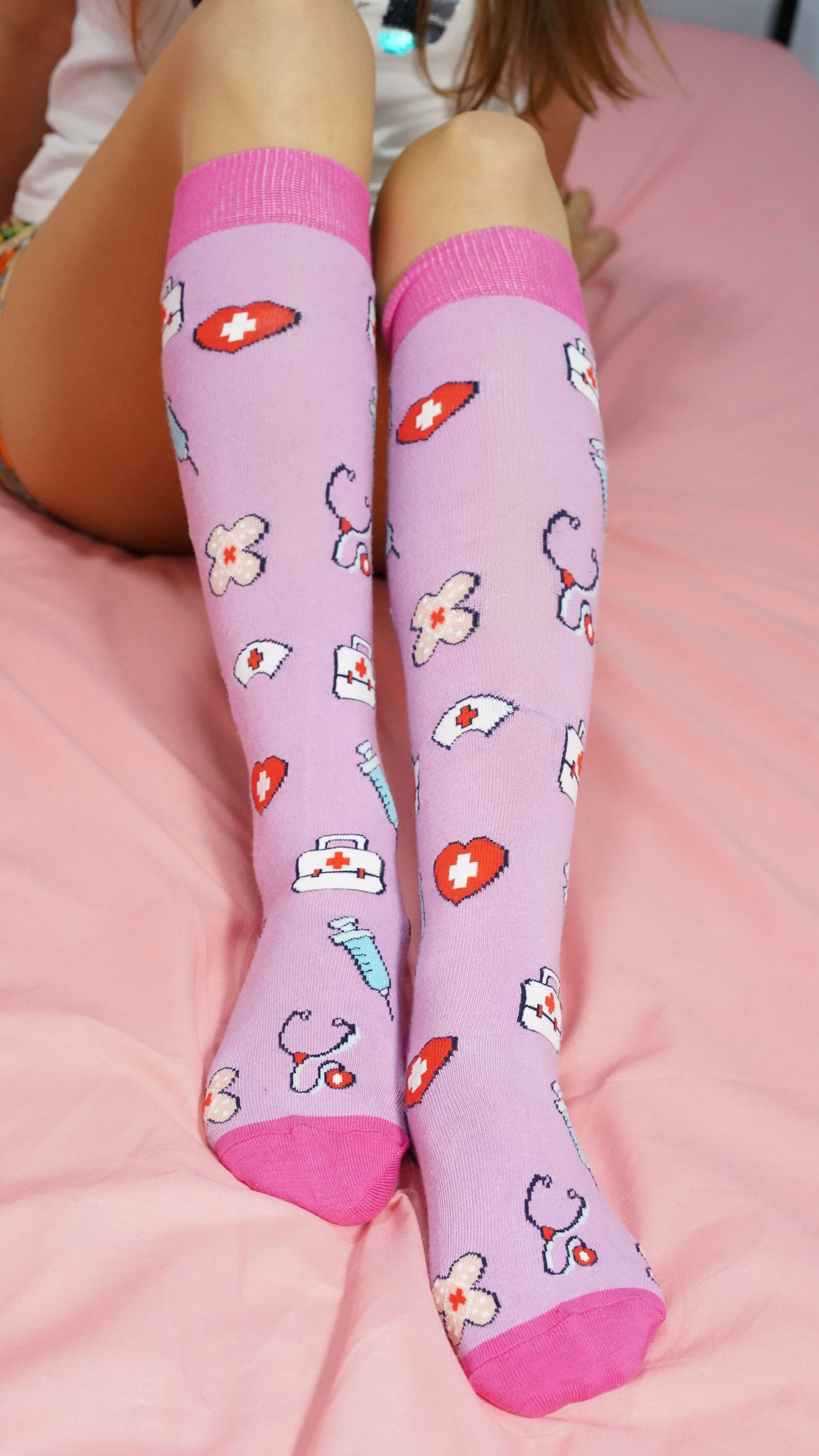 A pair of colorful Women's Nurse Knee High Socks made from soft Turkish cotton, featuring trendy patterns and a comfortable fit.