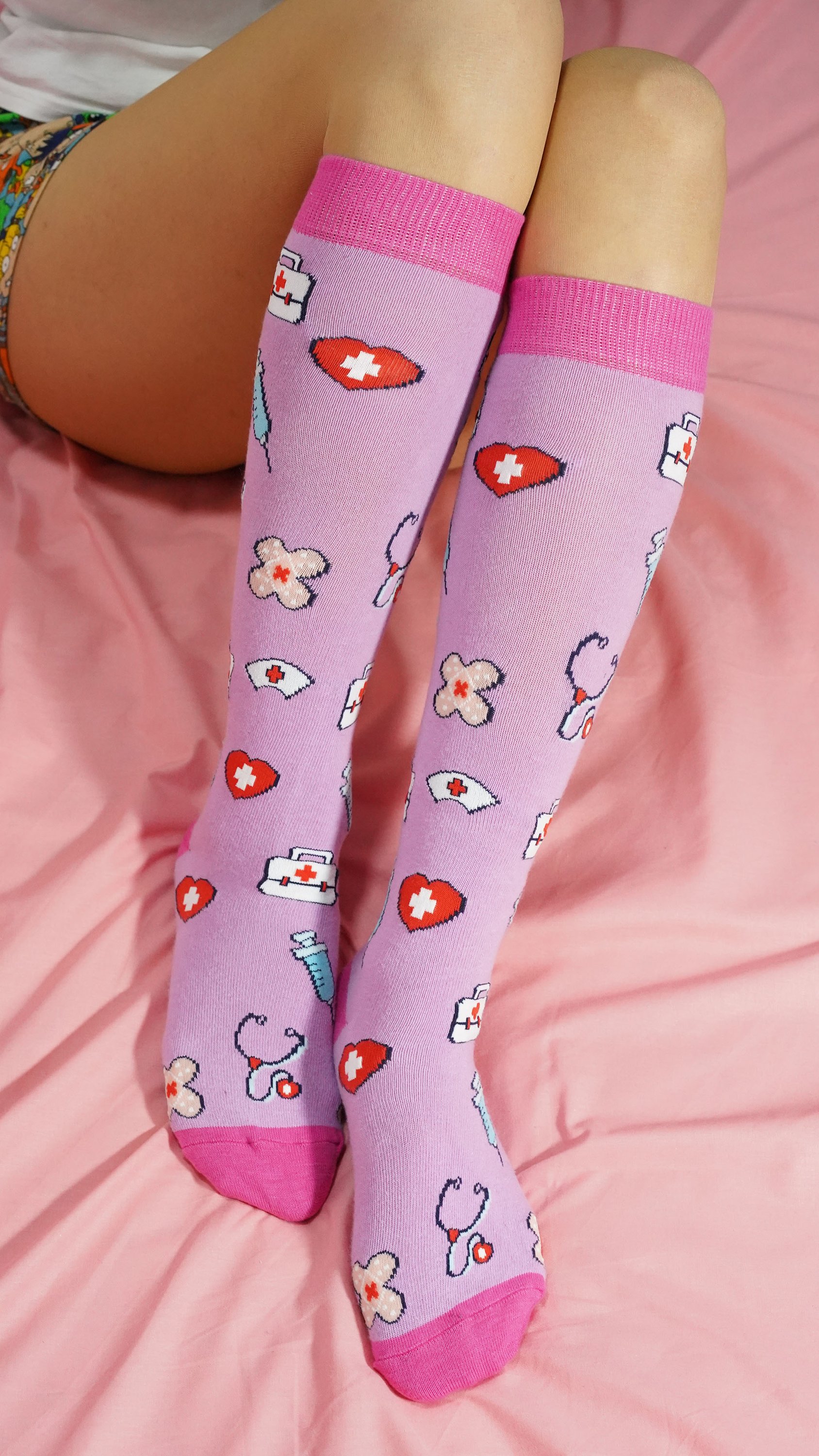 A pair of colorful Women's Nurse Knee High Socks made from soft Turkish cotton, featuring trendy patterns and a comfortable fit.