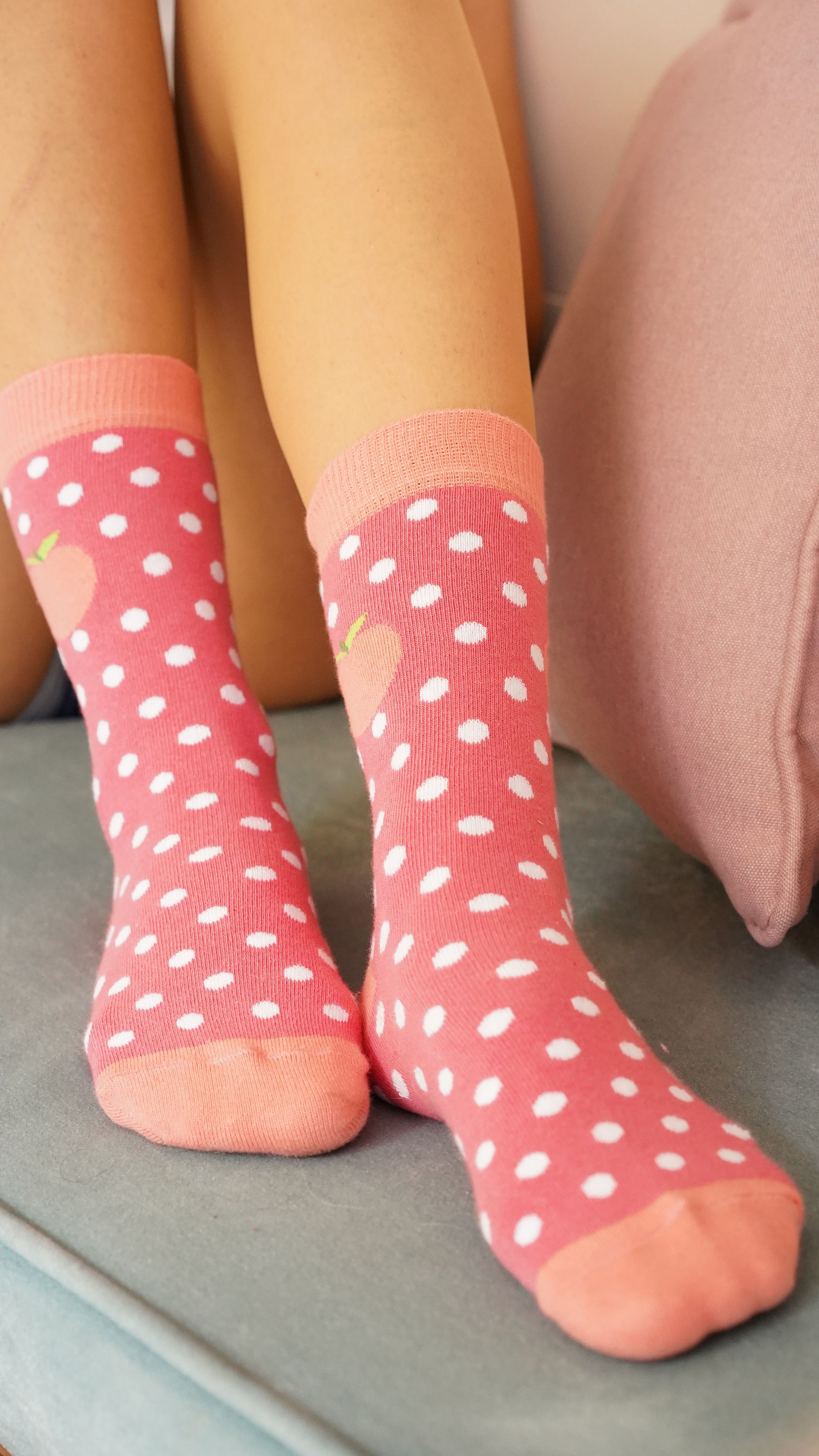 A pair of stylish Women's Peach Dot Socks featuring a playful peach dot pattern, made from soft Turkish cotton for comfort.