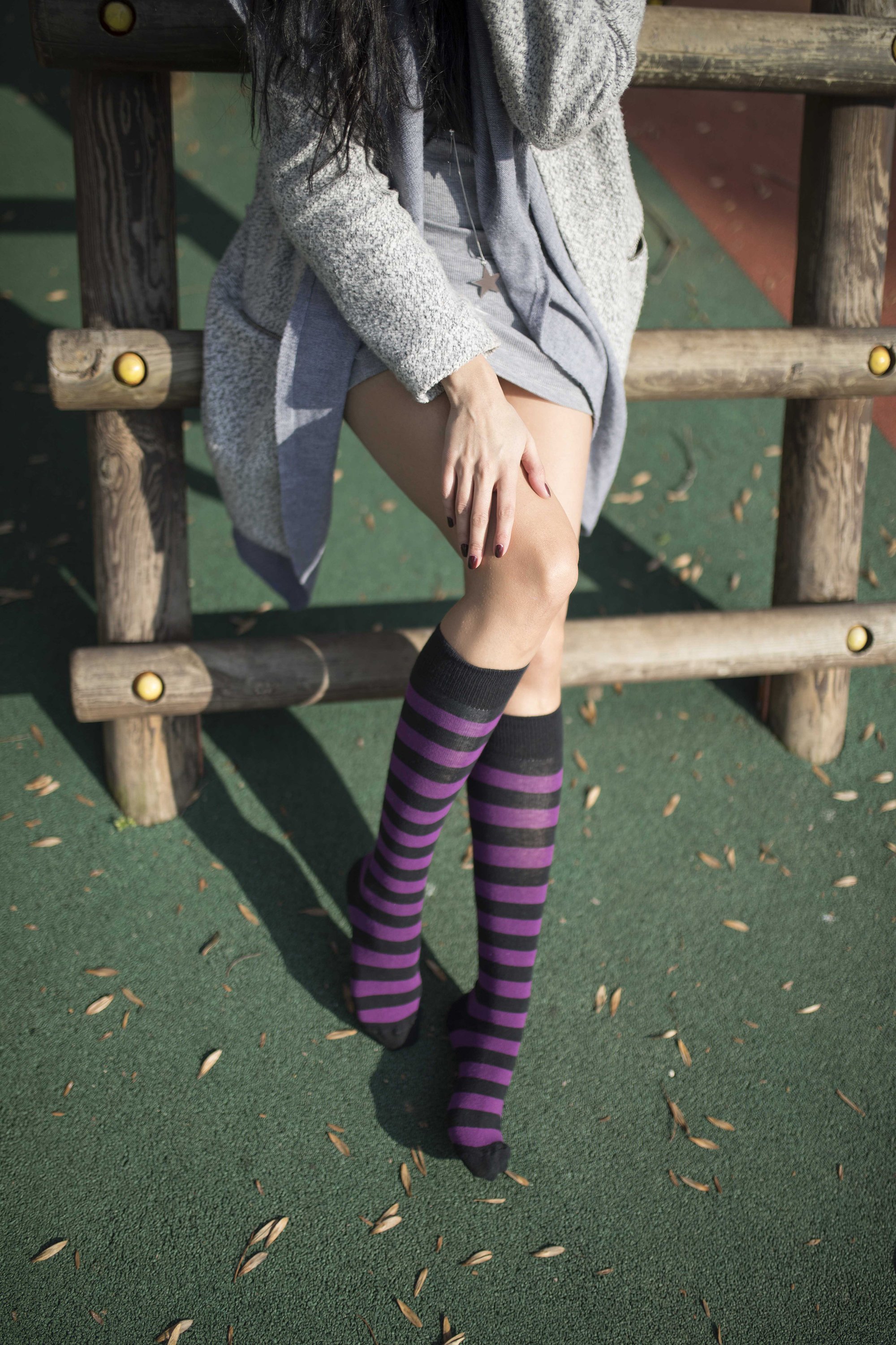 A pair of Women's Plum Stripe Knee High Socks featuring vibrant plum stripes and a comfortable fit, perfect for stylish outfits.