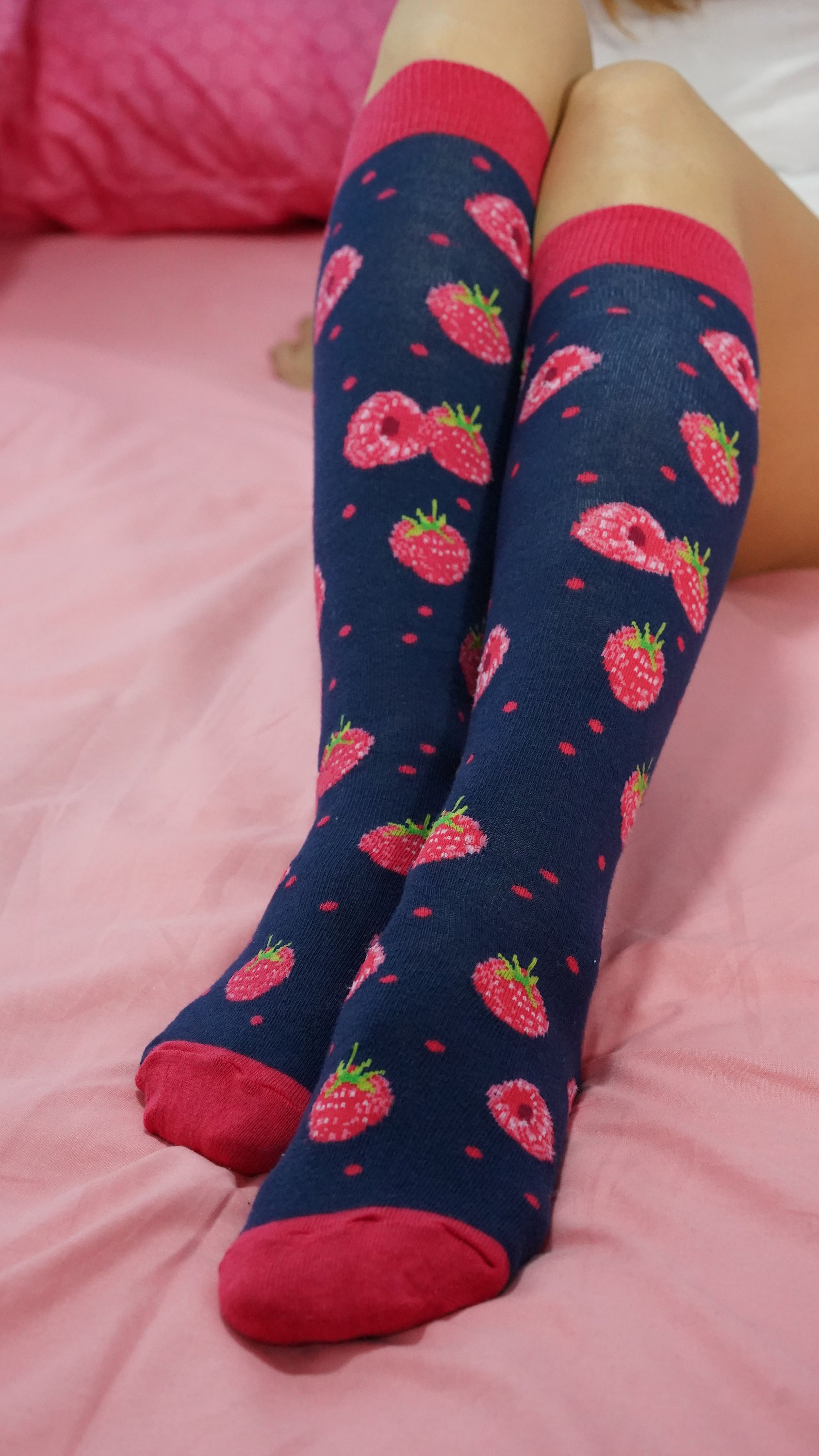 A pair of vibrant raspberry knee high socks made from soft Turkish cotton, featuring trendy patterns and a comfortable fit.