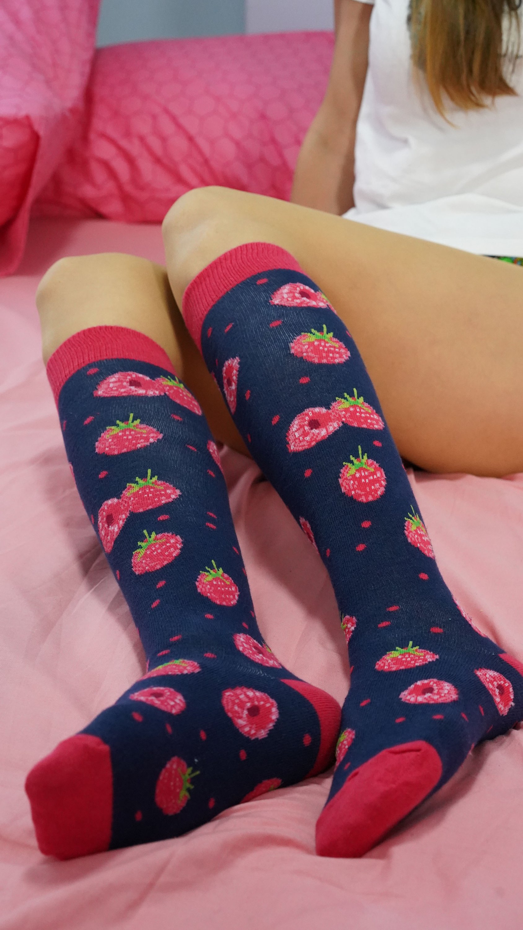 A pair of vibrant raspberry knee high socks made from soft Turkish cotton, featuring trendy patterns and a comfortable fit.