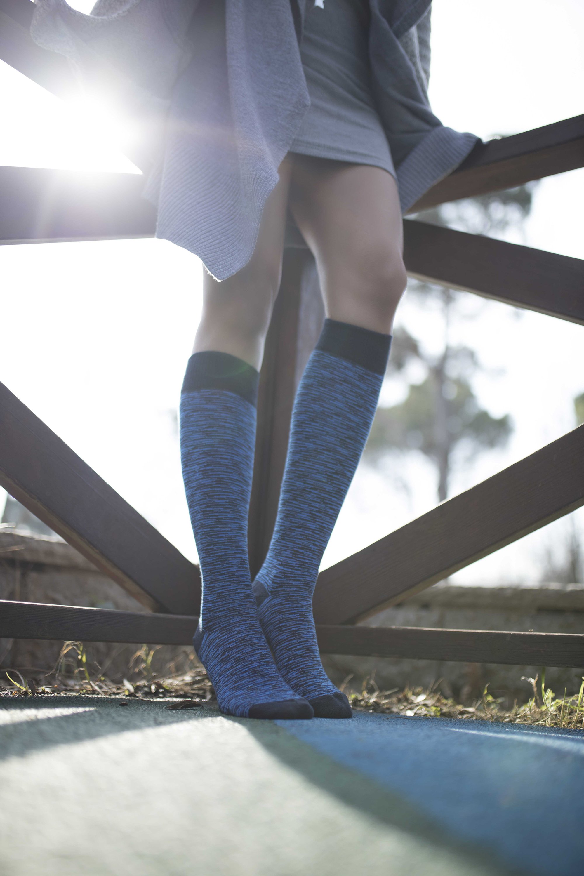 A pair of Women's Sky Grizzled Stripe Knee High Socks featuring colorful stripes and a soft texture, perfect for stylish comfort.