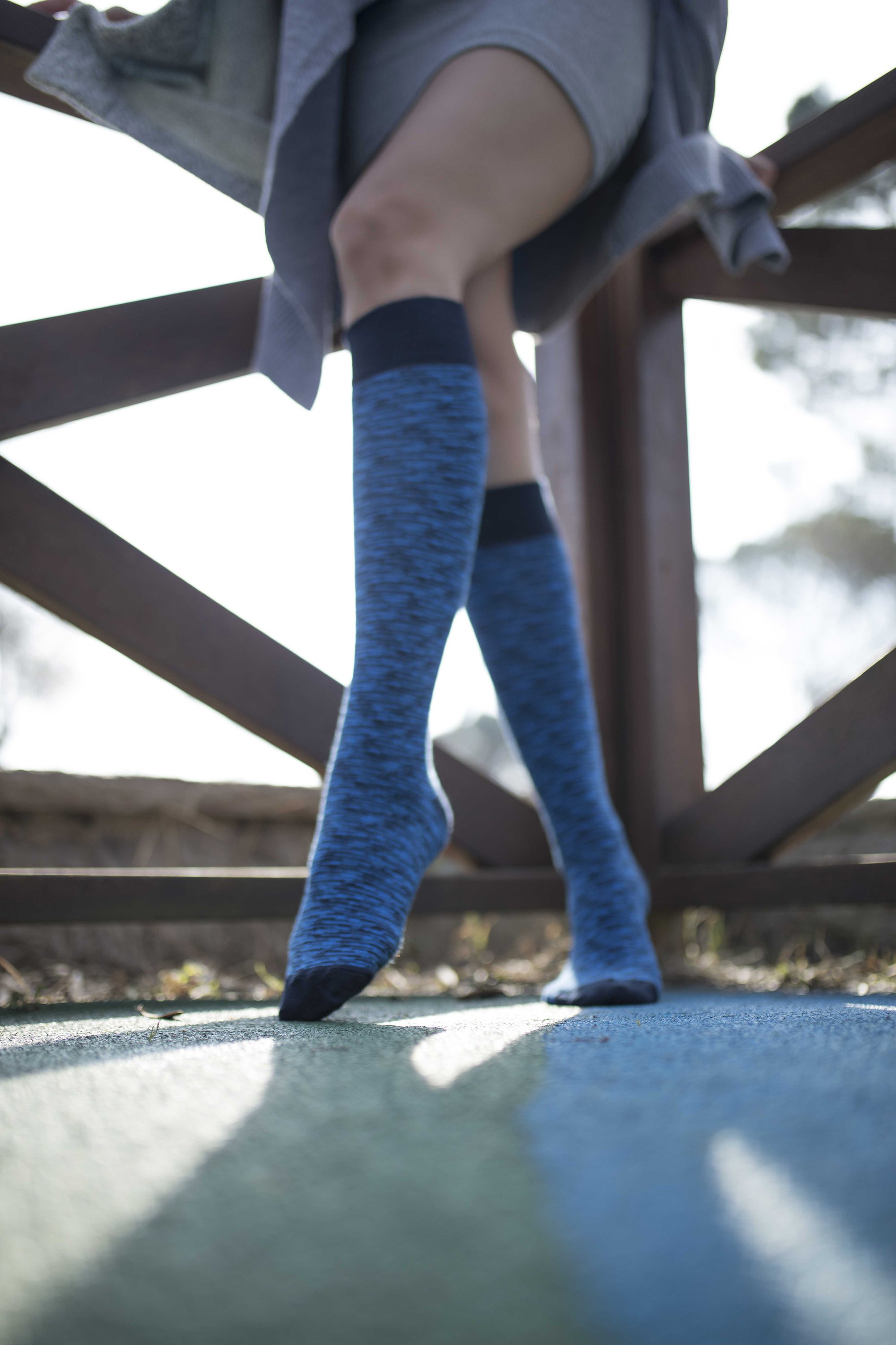 A pair of Women's Sky Grizzled Stripe Knee High Socks featuring colorful stripes and a soft texture, perfect for stylish comfort.