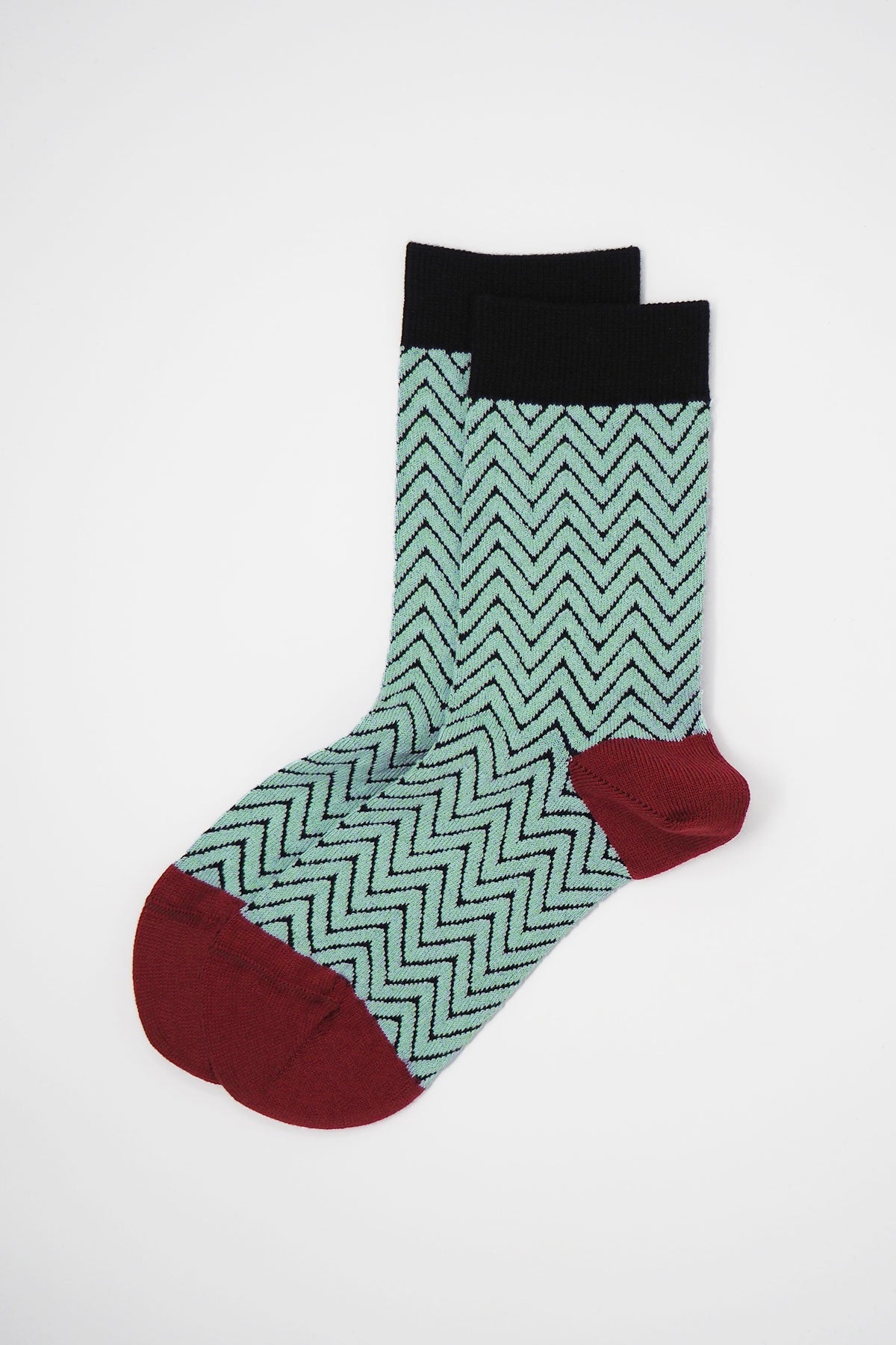 A pair of luxurious black Zigzag Women's Socks made from soft Supima cotton, featuring a stylish zigzag pattern.