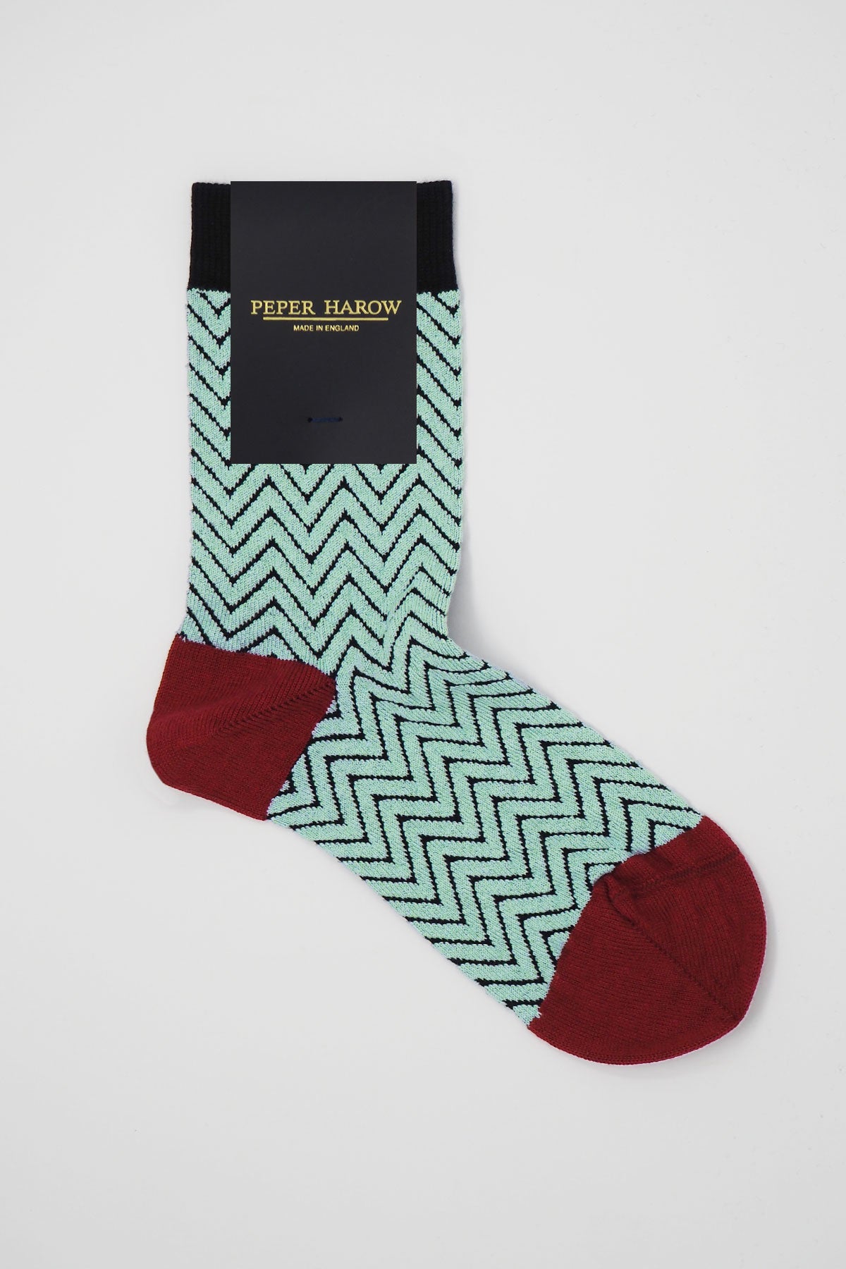 A pair of luxurious black Zigzag Women's Socks made from soft Supima cotton, featuring a stylish zigzag pattern.